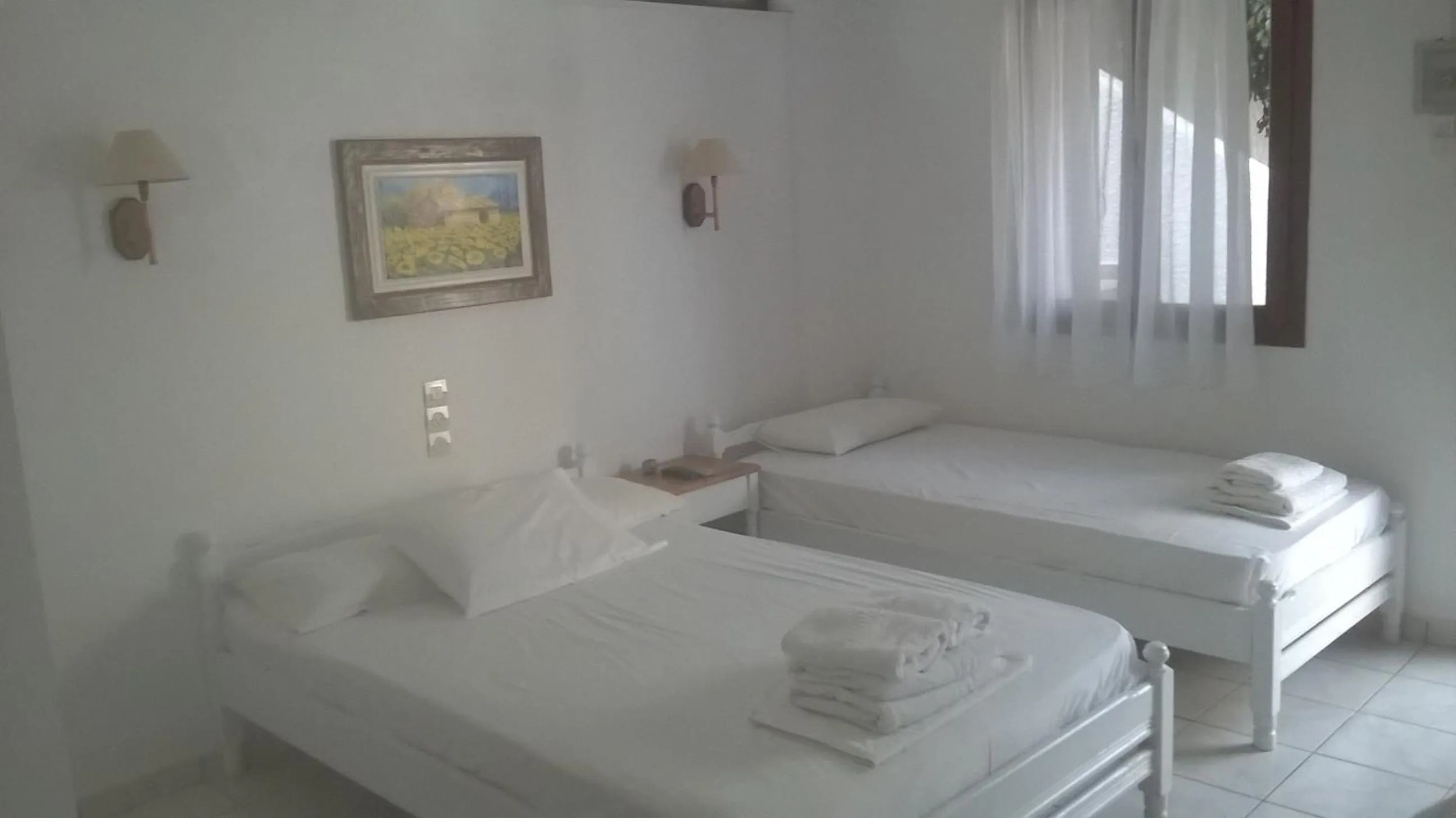 Bed in Aeolos Hotel Apartments