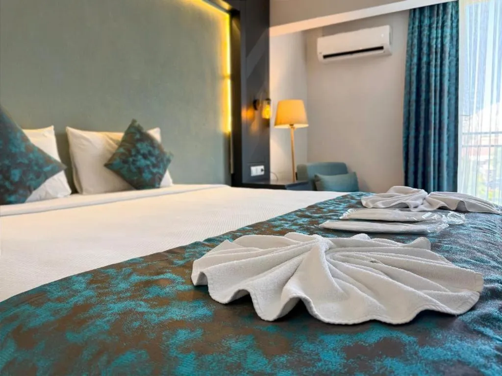 Bed in ANYA RESORT HOTEL