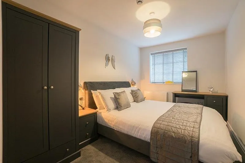 Bed in The Queens Arms Apartments