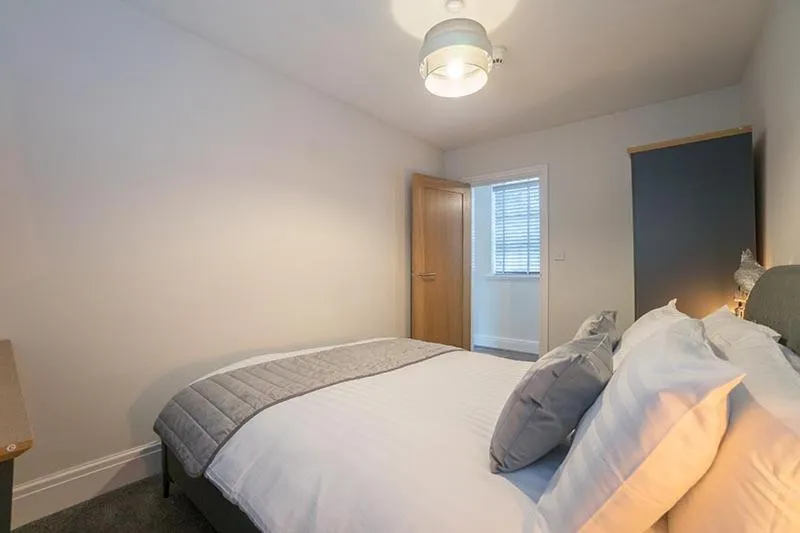 Bed in The Queens Arms Apartments