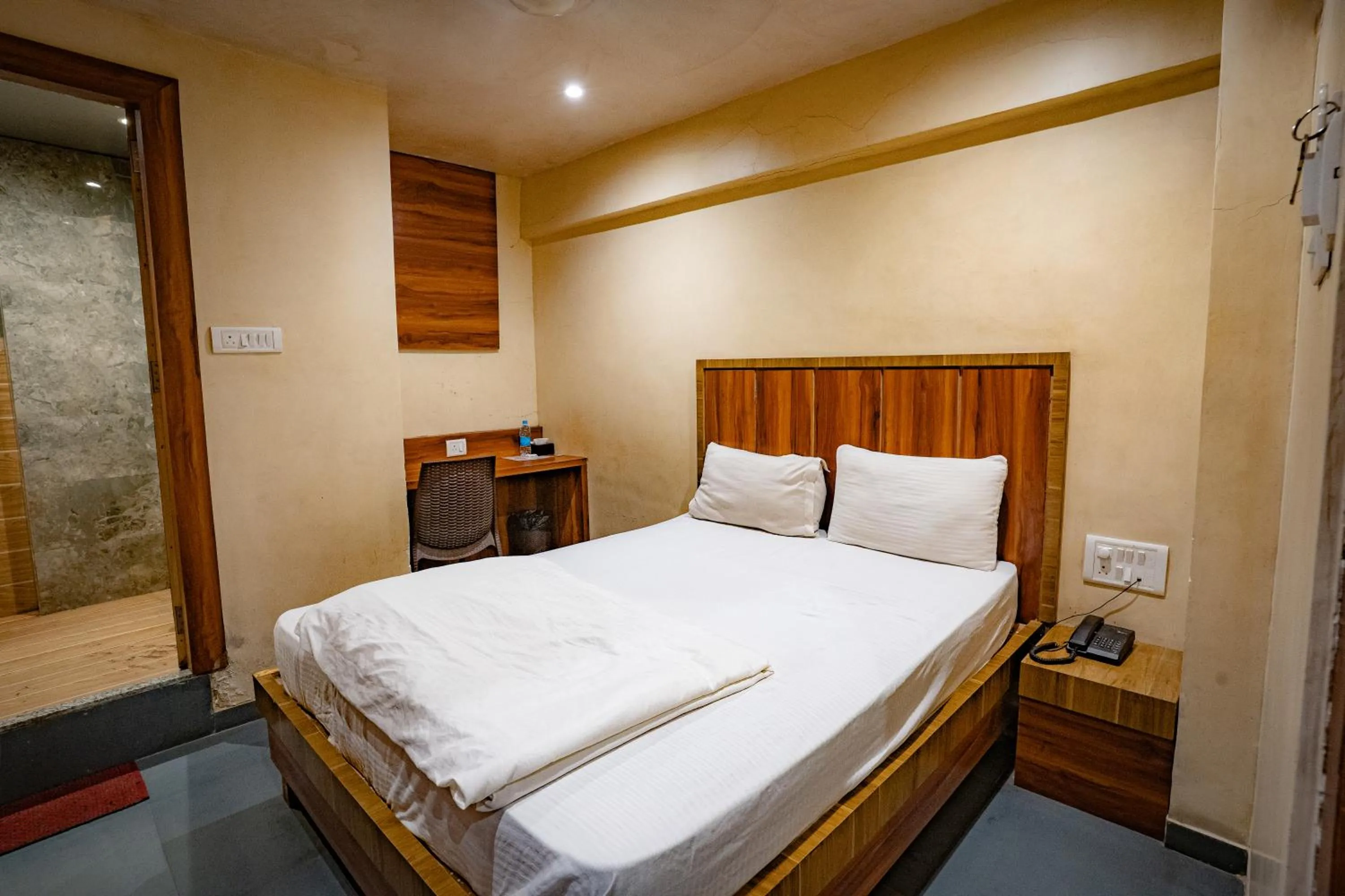 Bed in Hotel Mourya Residency
