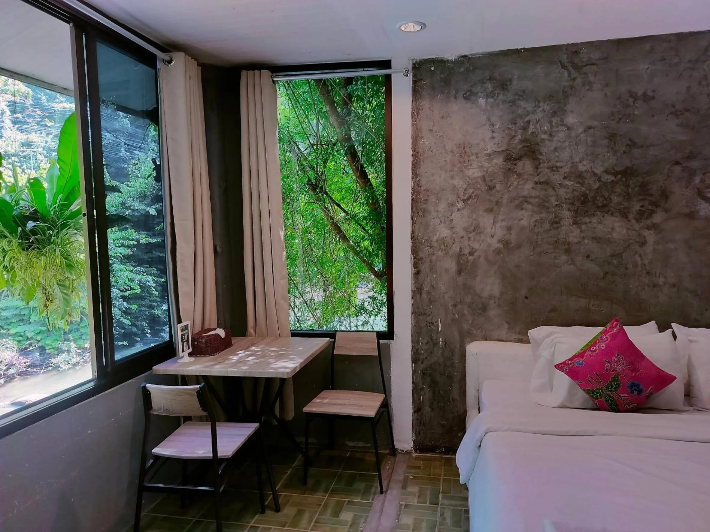 Seating area, Bed in THANSILA Resort