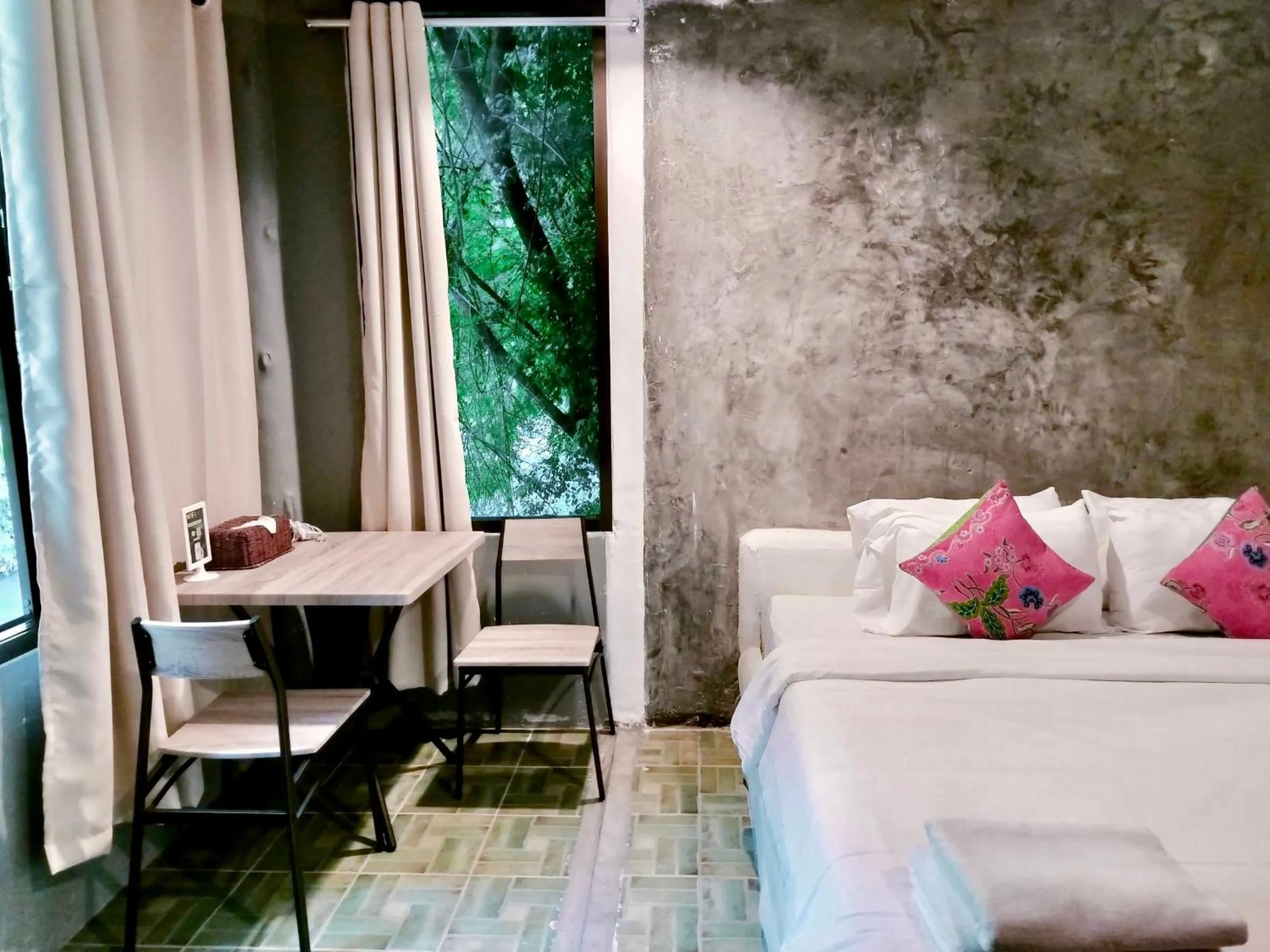 Seating area, Bed in THANSILA Resort