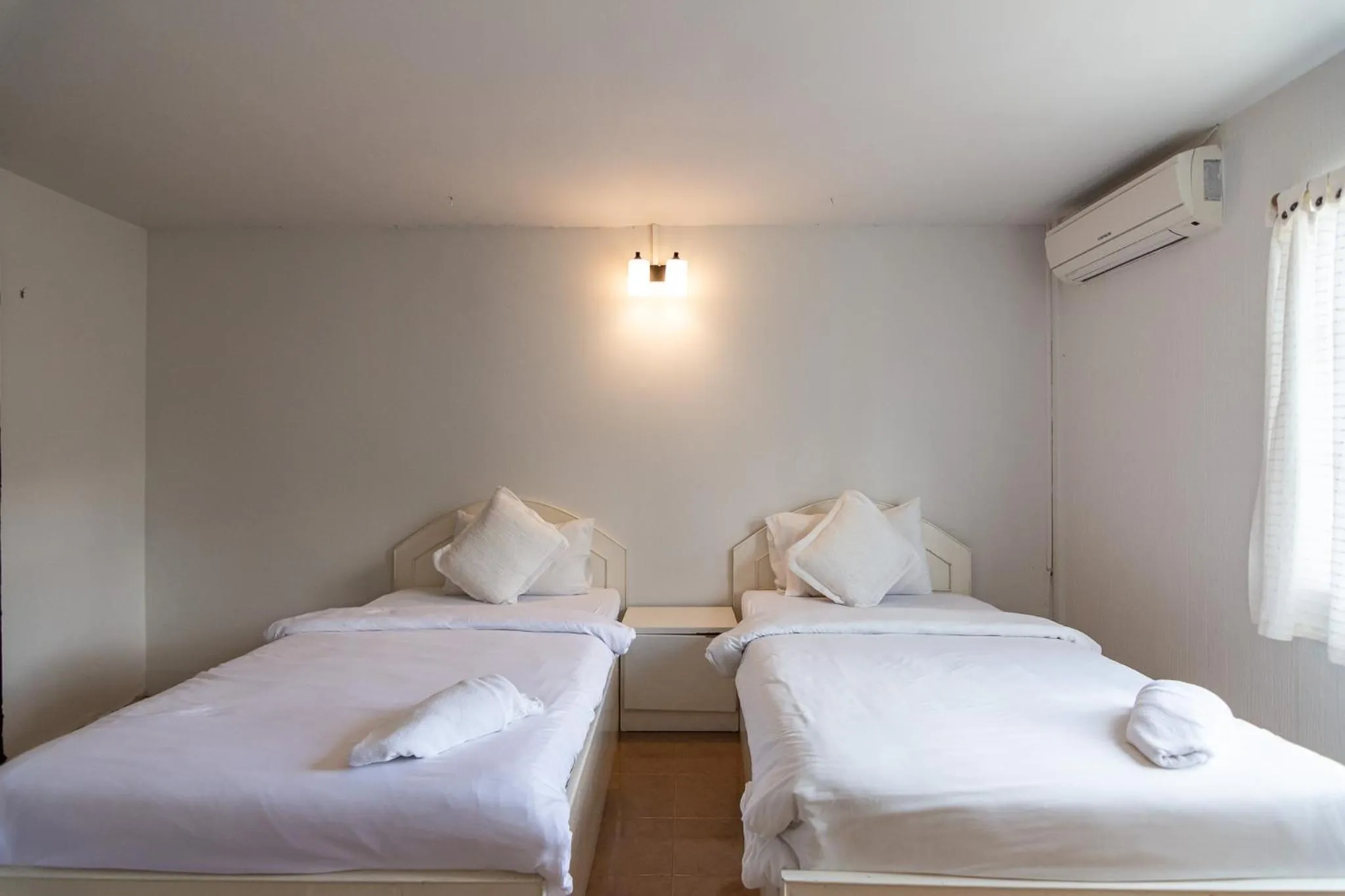 Bed in THANSILA Resort