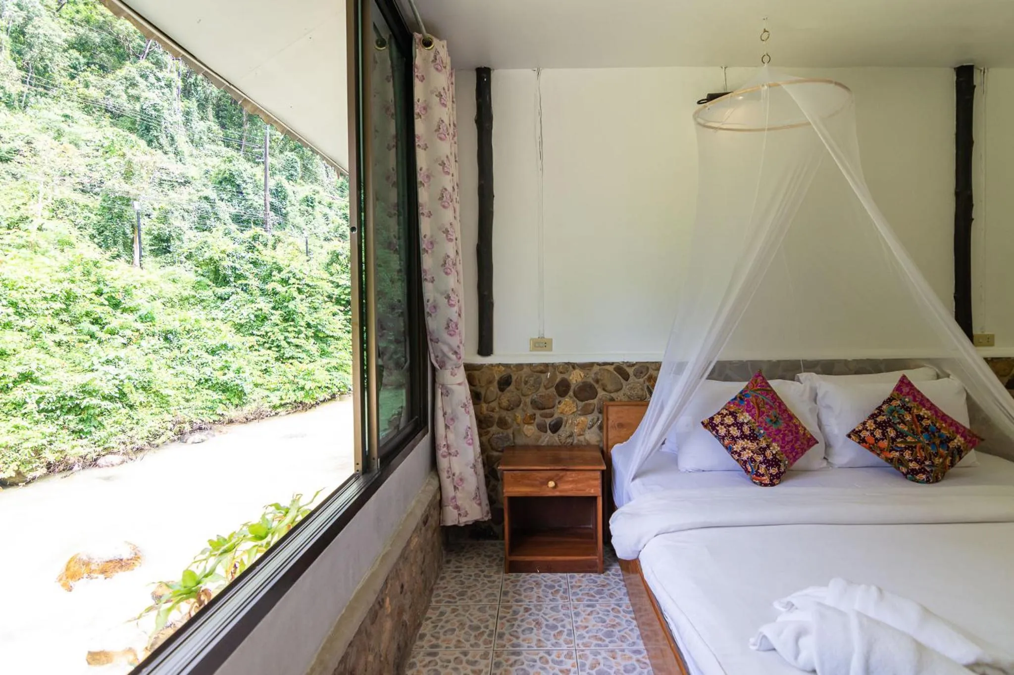 Bed in THANSILA Resort