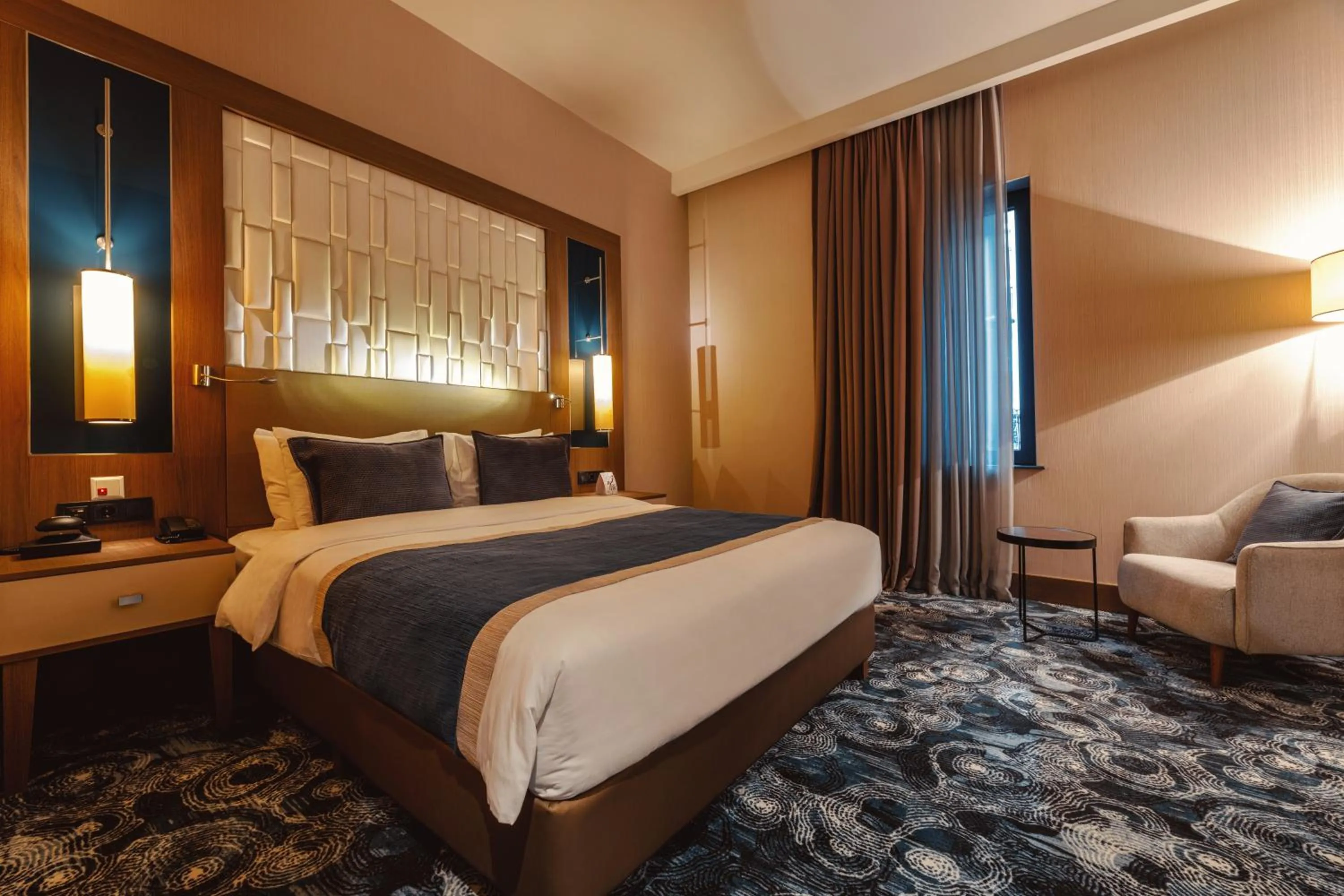 Bed in Tbilisi Philharmonic Hotel by Mercure