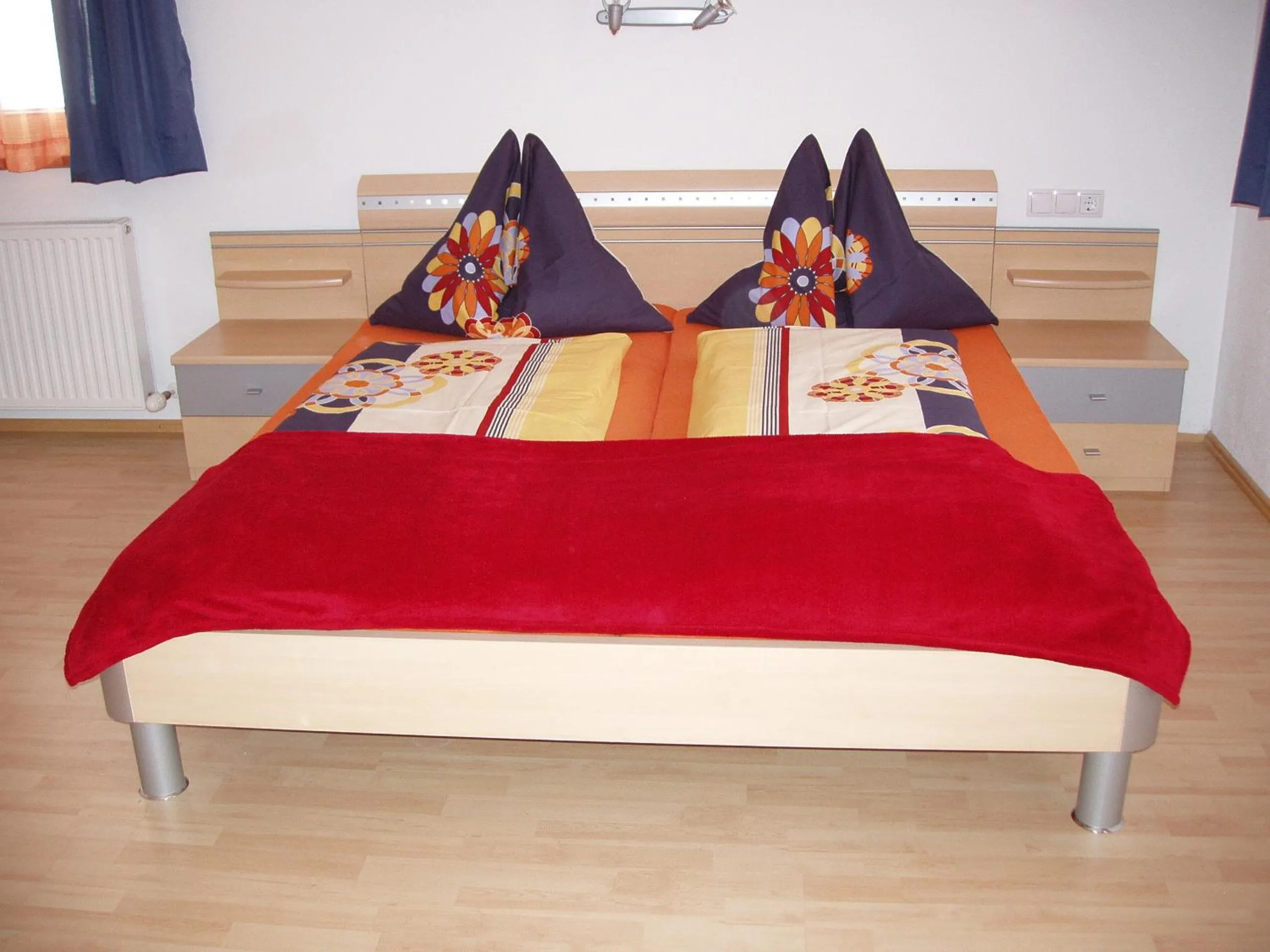 Bed in Ferienwohnung Wohlfartstätter