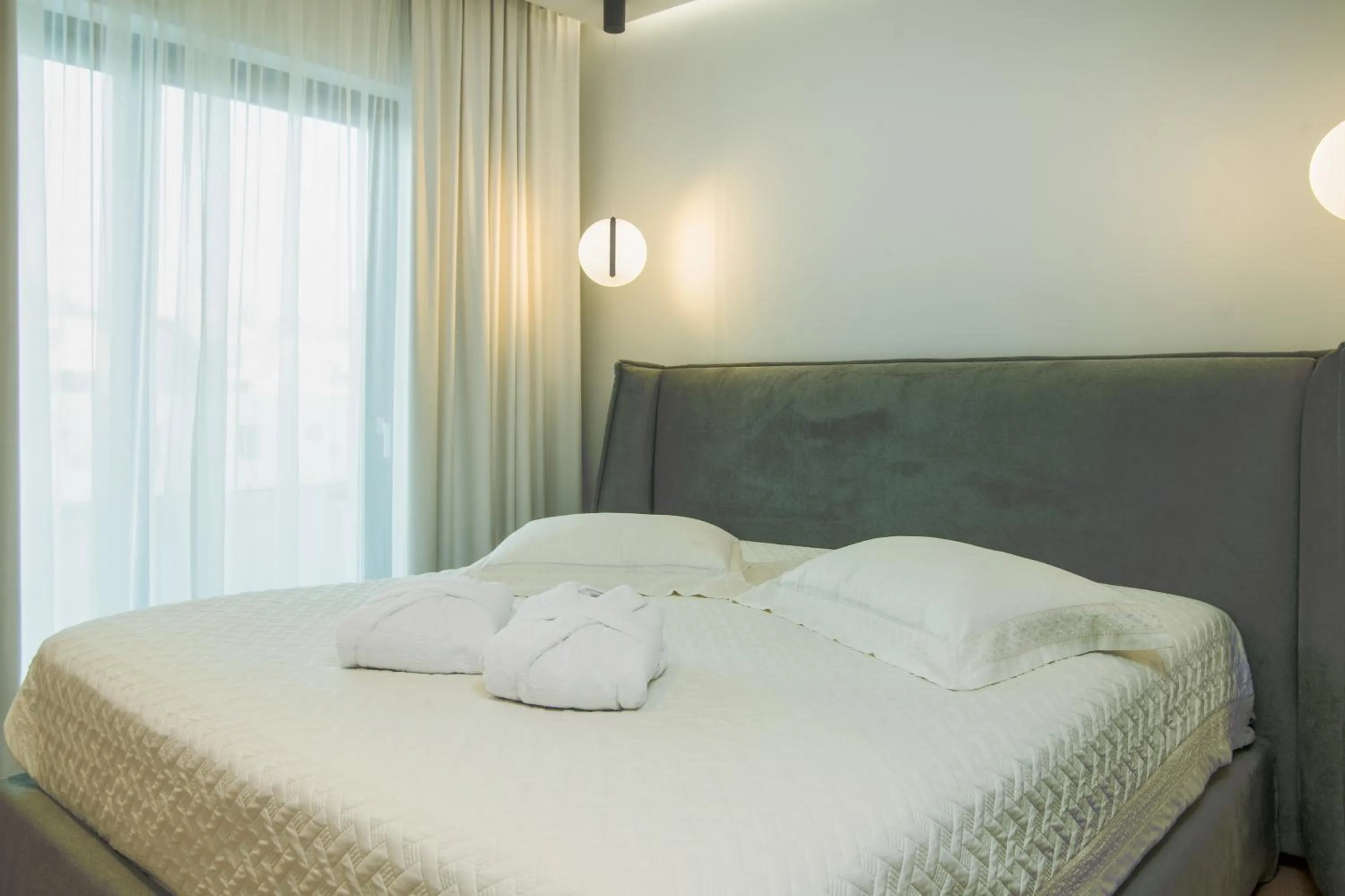 Bed in Celine Luxury Apartments & Suites