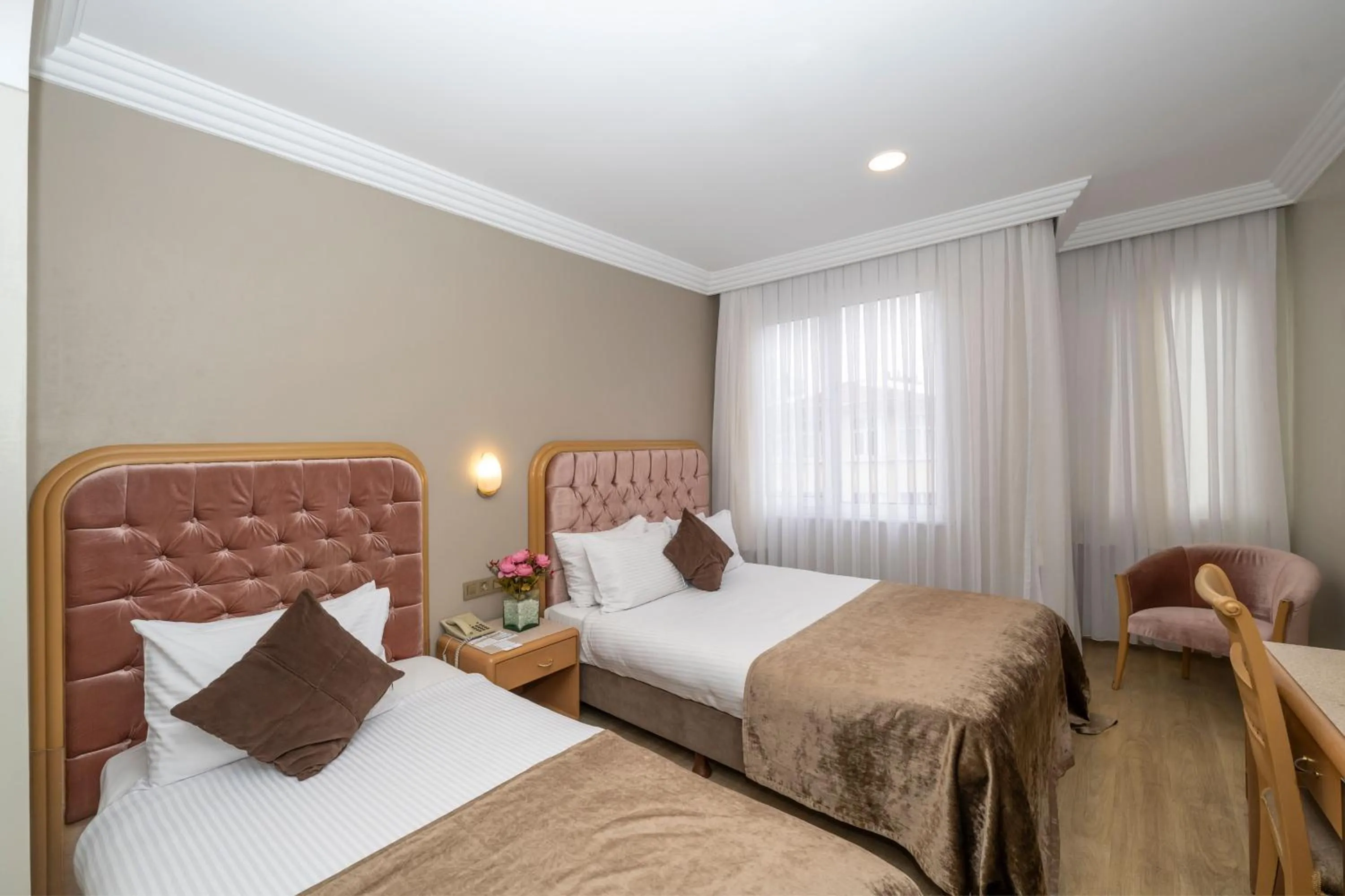 Bed in Grand Anka Hotel