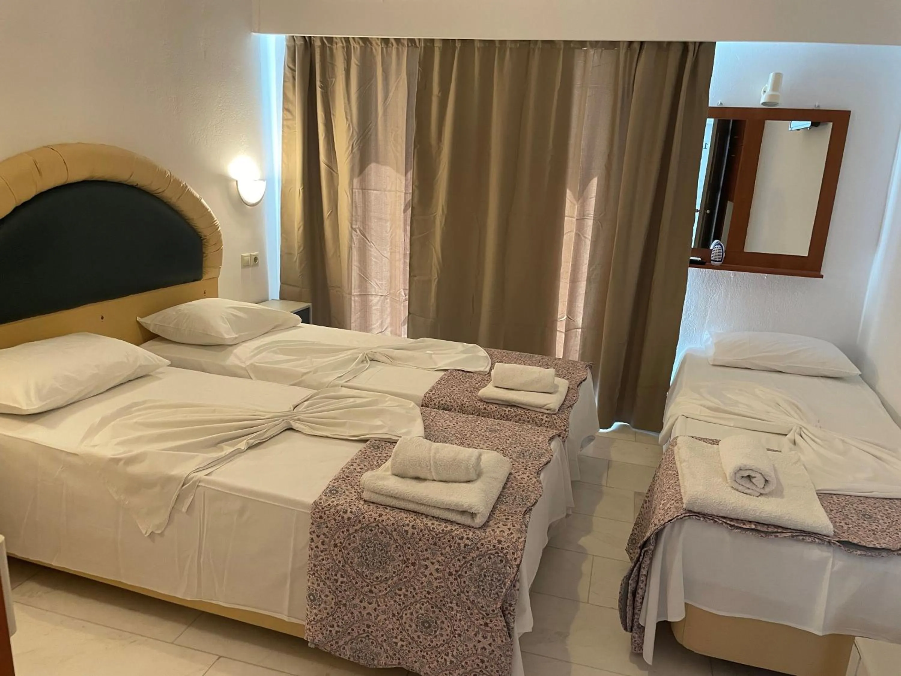 Bed in Hotel Kourkoumelata