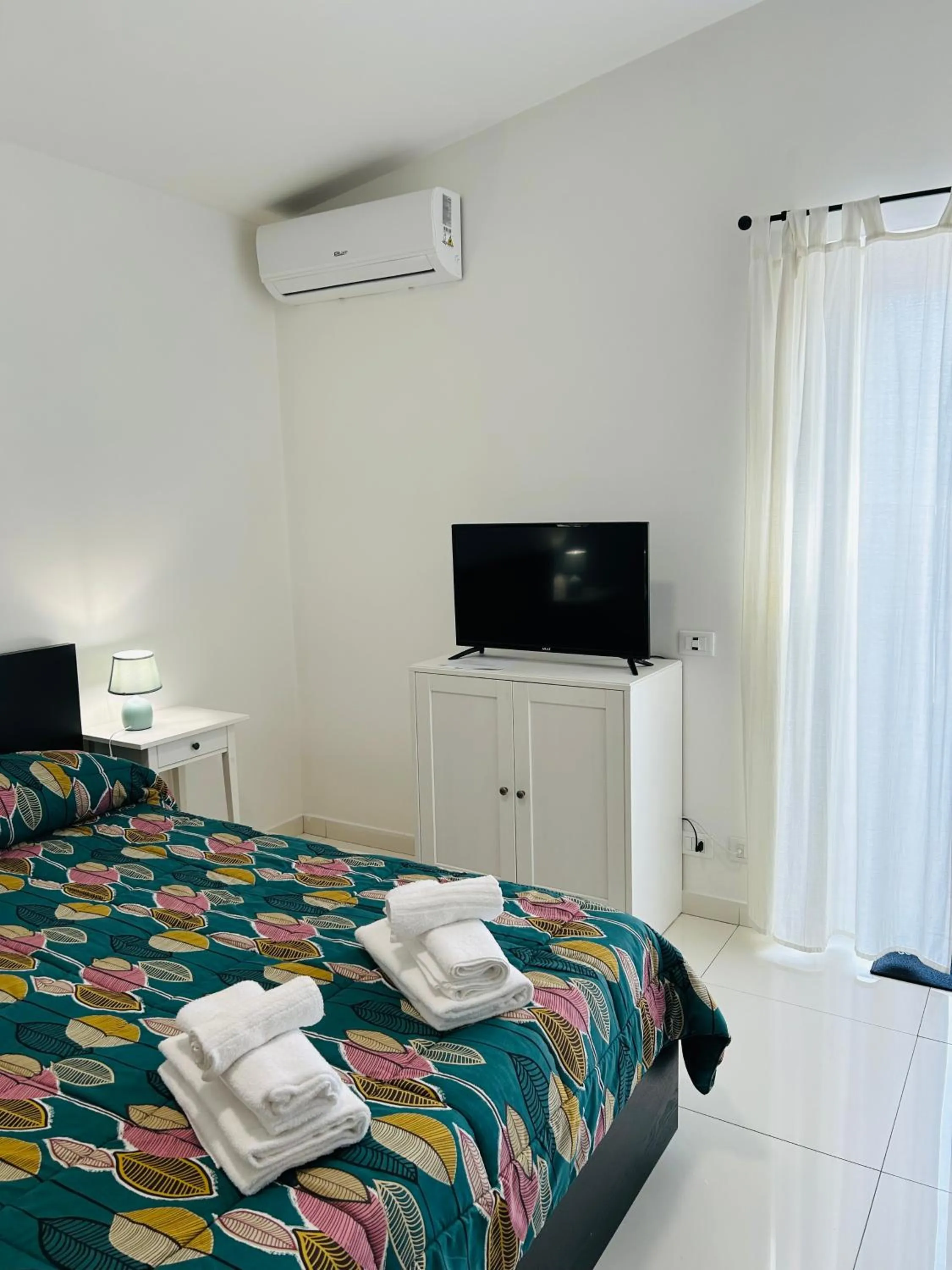 Bed in THE HOUSE FIERA di ROMA AEROPORTO FIUMICINO