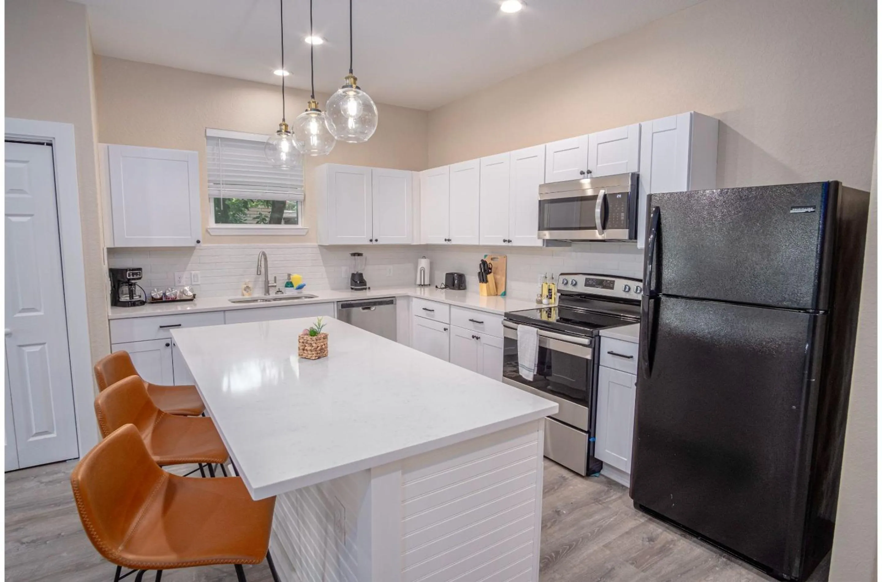 Kitchen or kitchenette in Beautiful Fenced 3BR 2BA Near Exciting Downtown