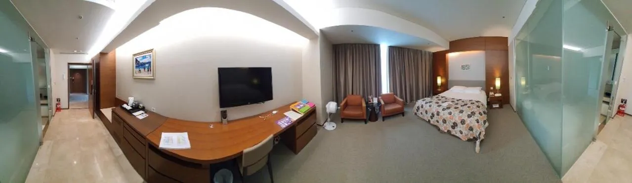 Bed in High1 Grand Hotel Convention Tower