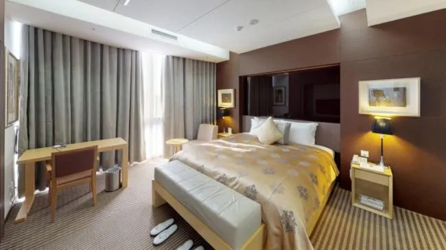 Bed in High1 Grand Hotel Convention Tower