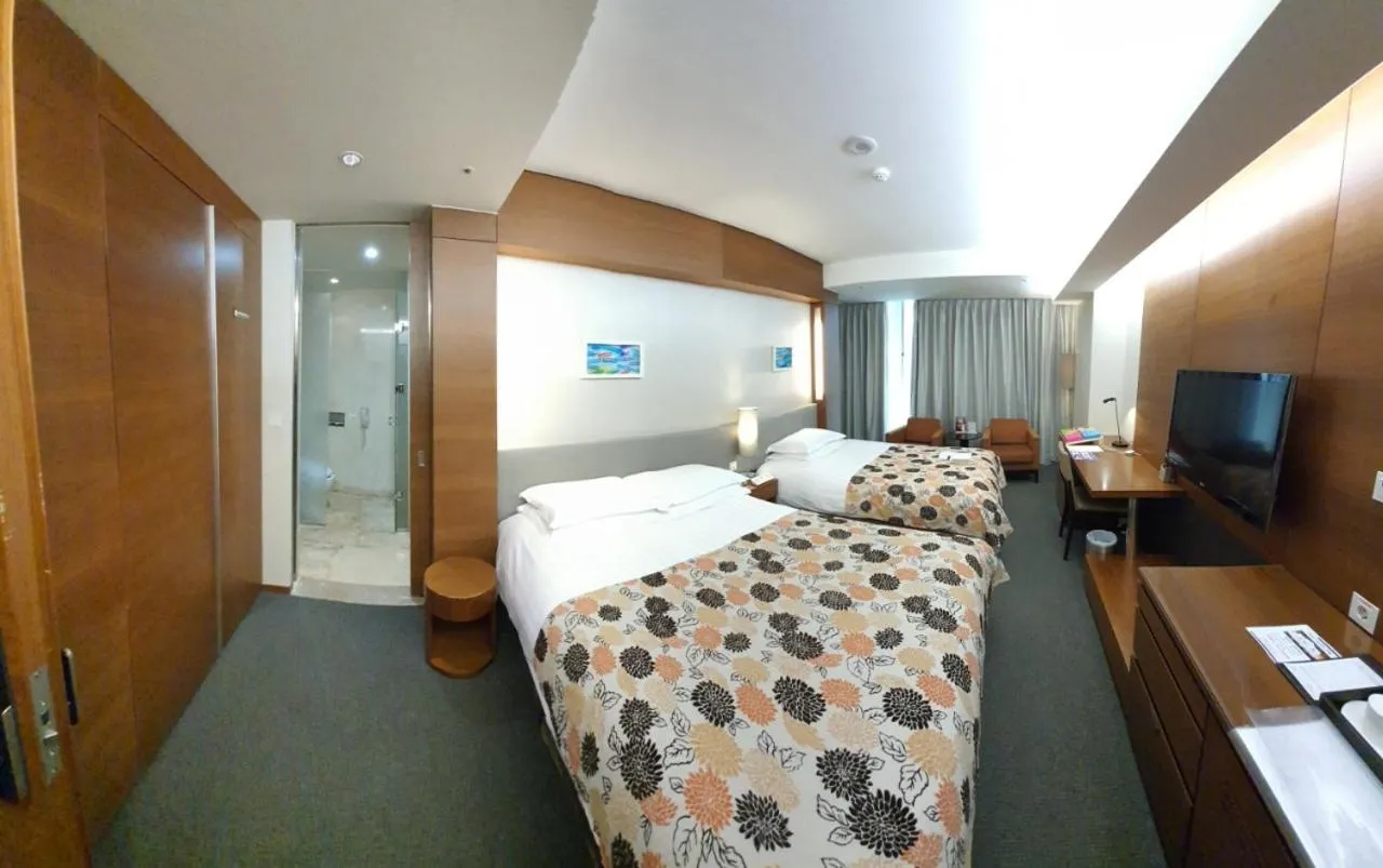 Bed in High1 Grand Hotel Convention Tower