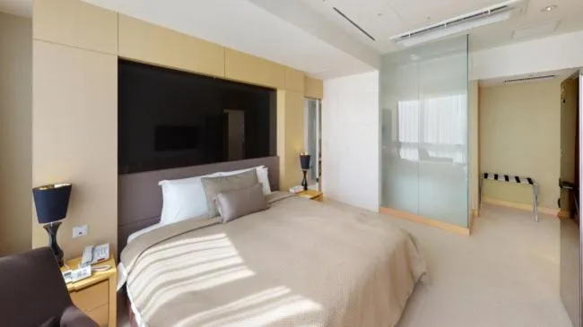 Bed in High1 Grand Hotel Convention Tower