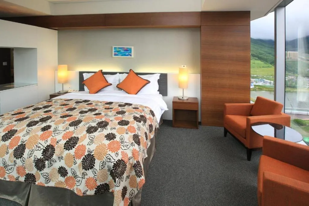 Bed in High1 Grand Hotel Convention Tower