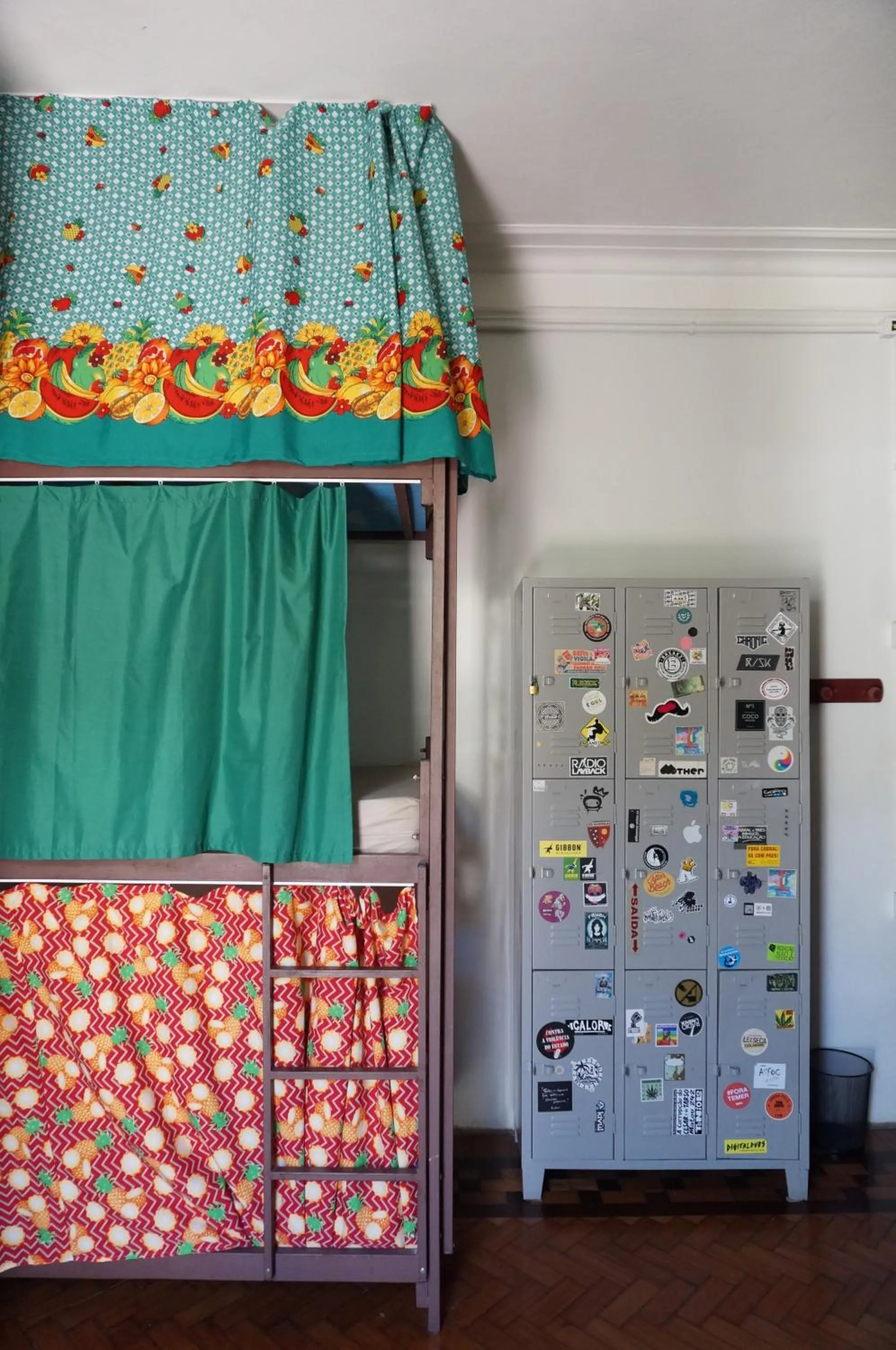 single bed in shared dormitory room with balcony in Mambembe Hostel