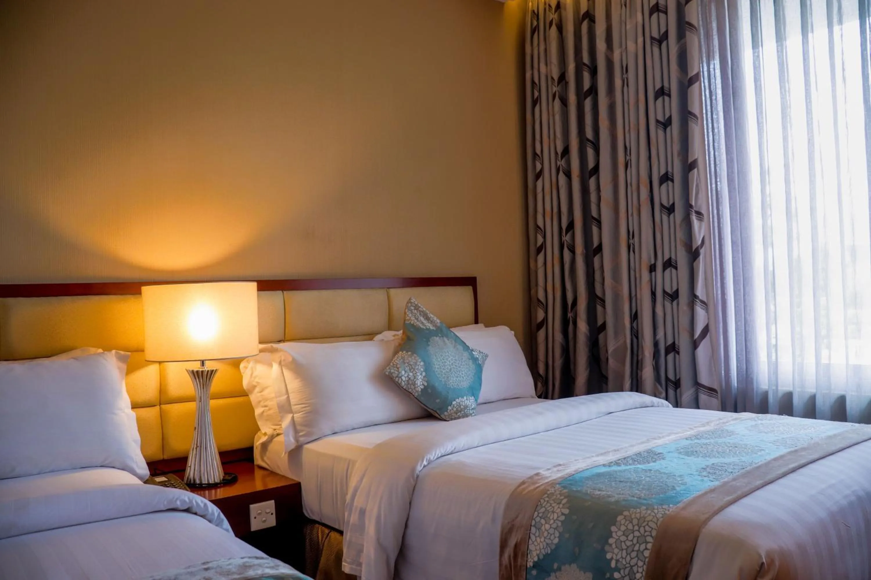 Bed in The Avenue Plaza Hotel