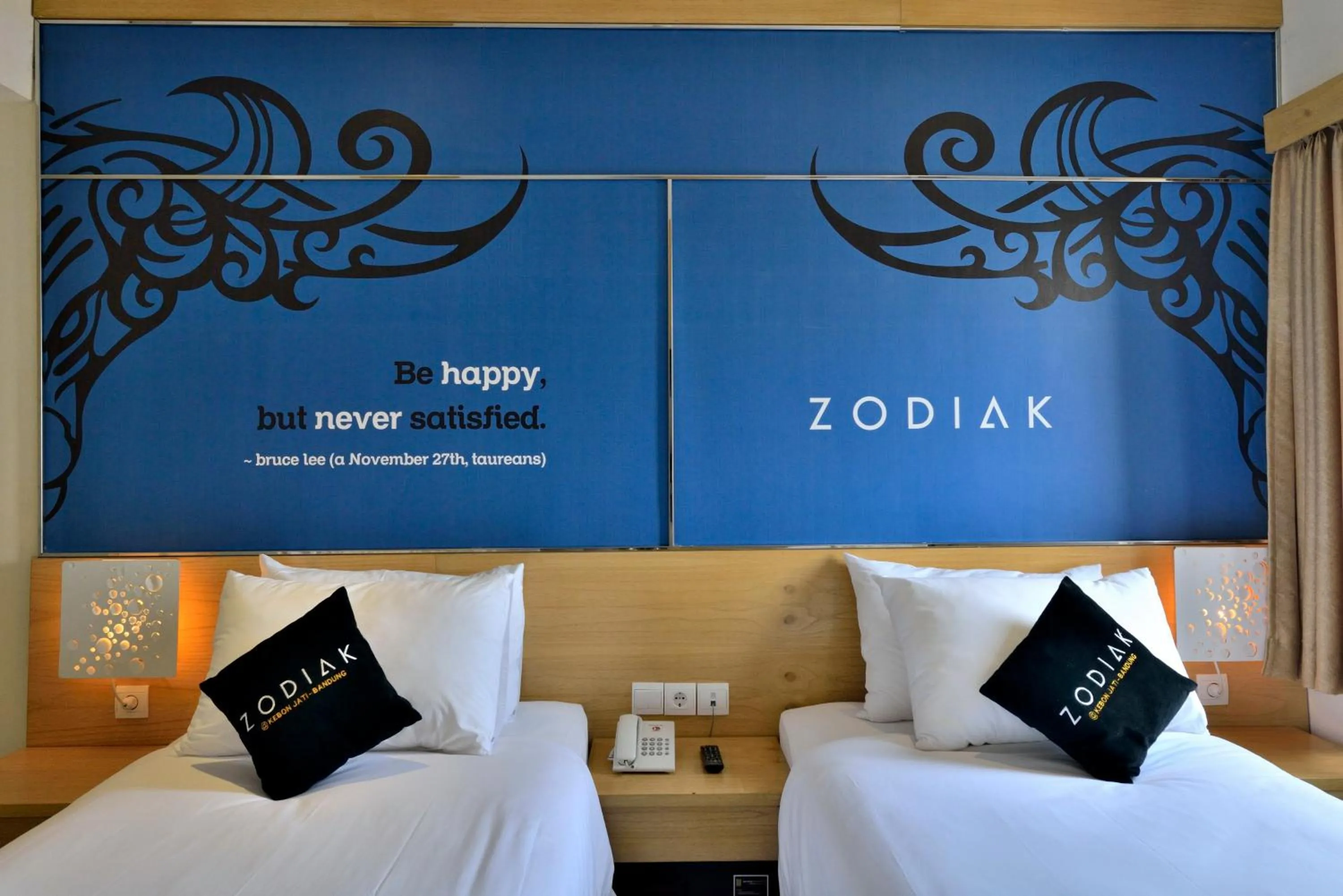 Bed in Zodiak at Kebon Jati Hotel