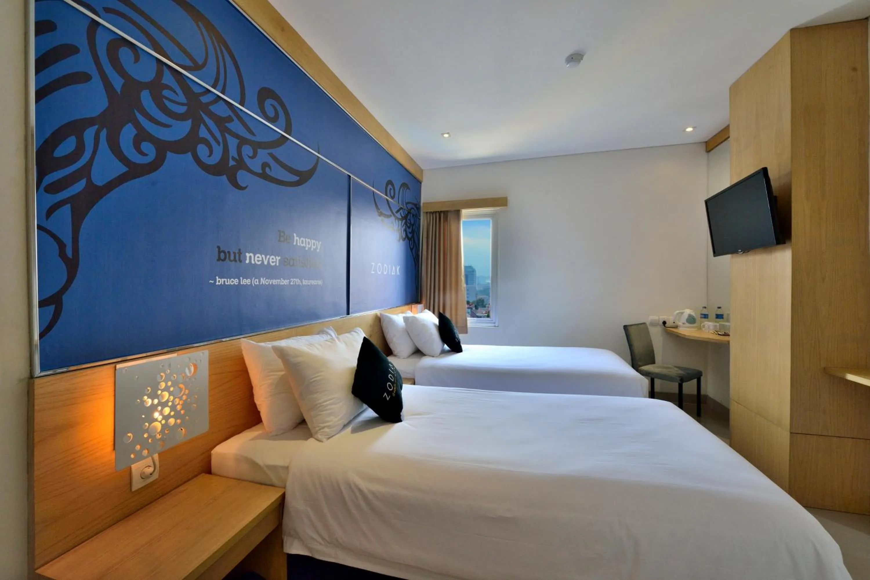 Bed in Zodiak at Kebon Jati Hotel