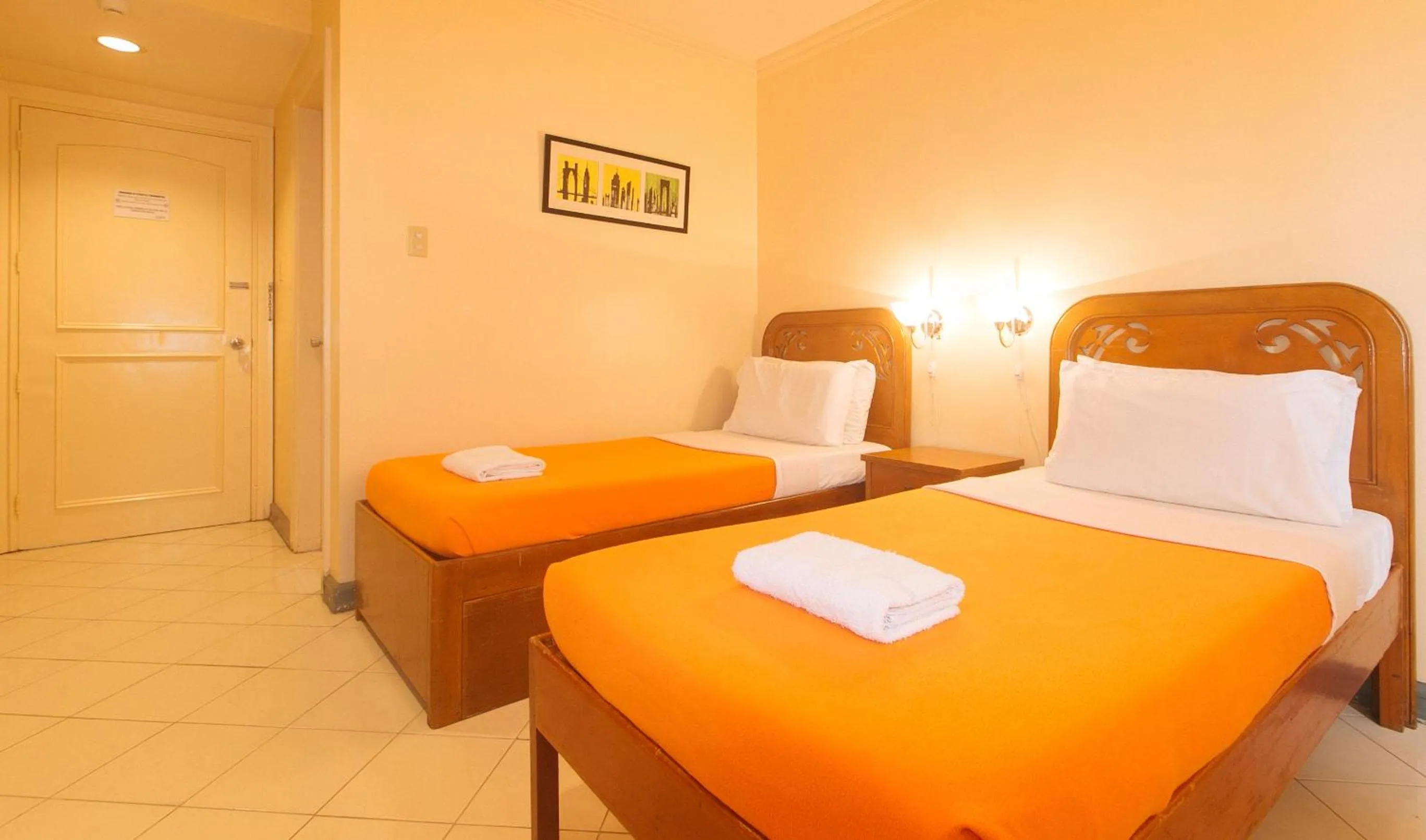 Bed in Royal Am Rei Hotel by RedDoorz