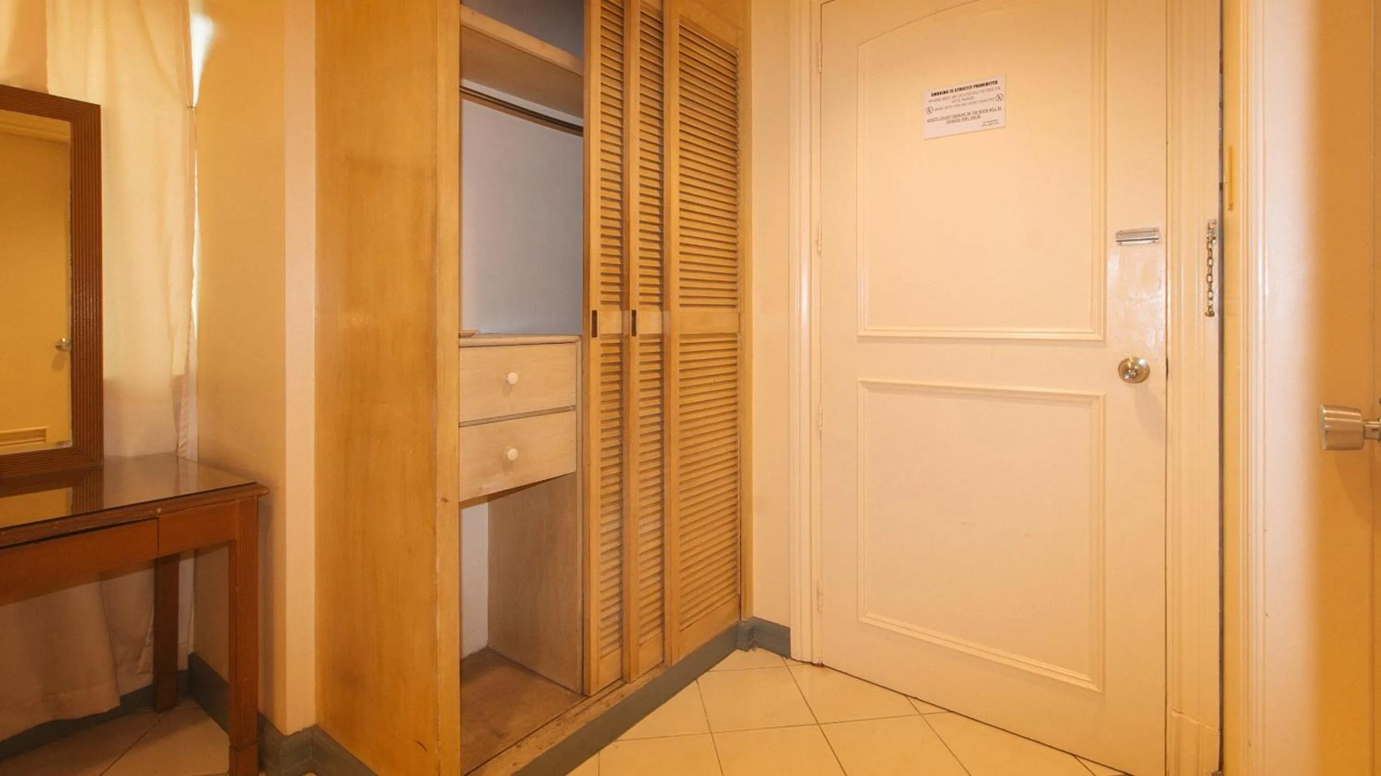 Bedroom in Royal Am Rei Hotel by RedDoorz