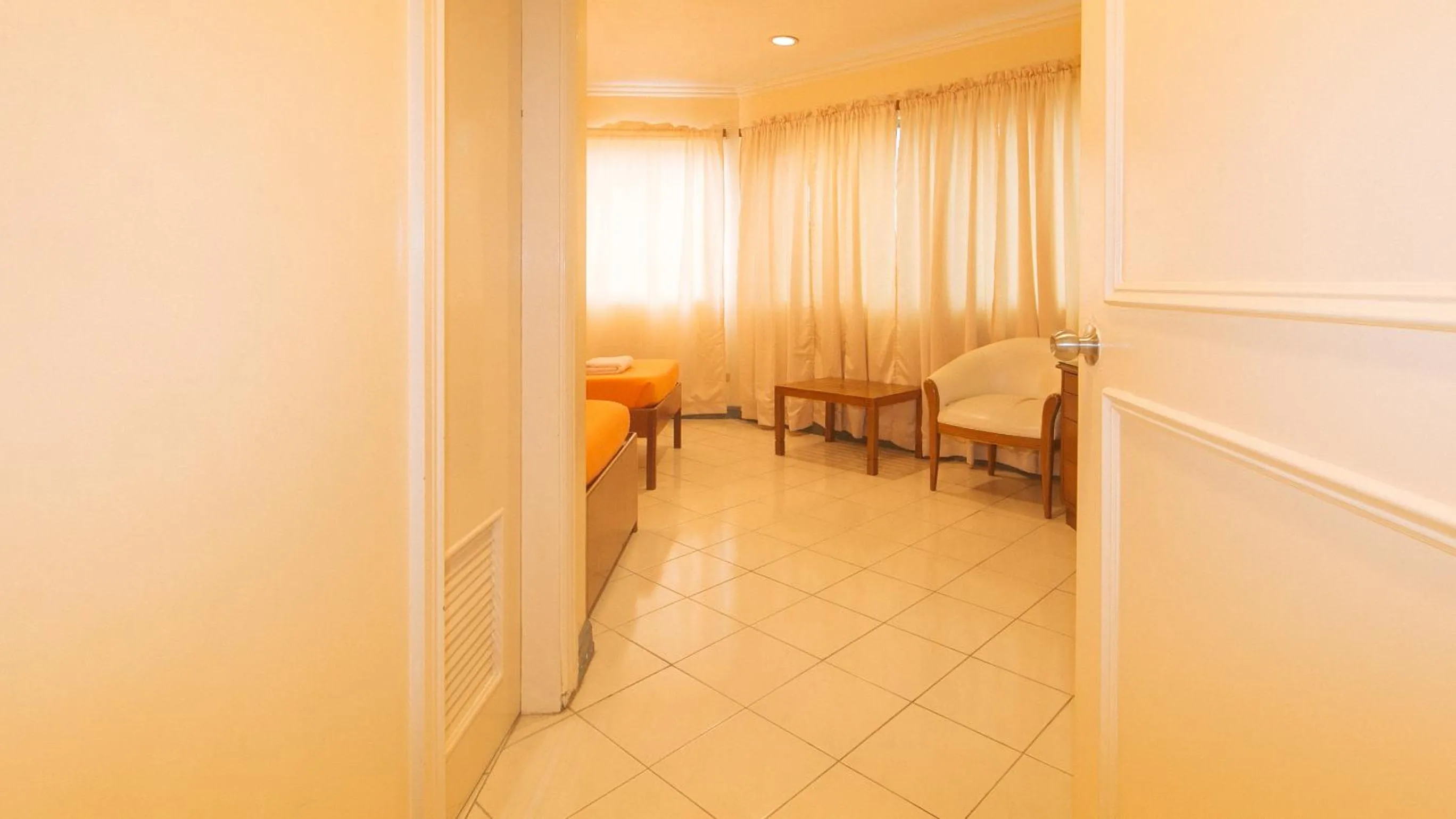 Bedroom in Royal Am Rei Hotel by RedDoorz