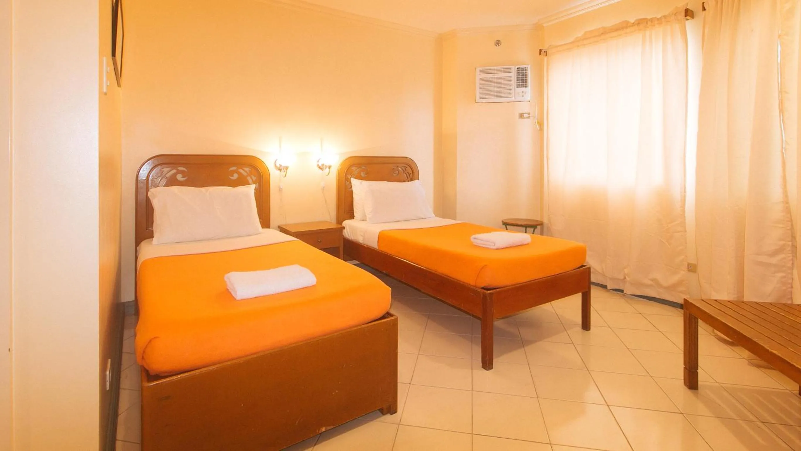 Bedroom, Bed in Royal Am Rei Hotel by RedDoorz