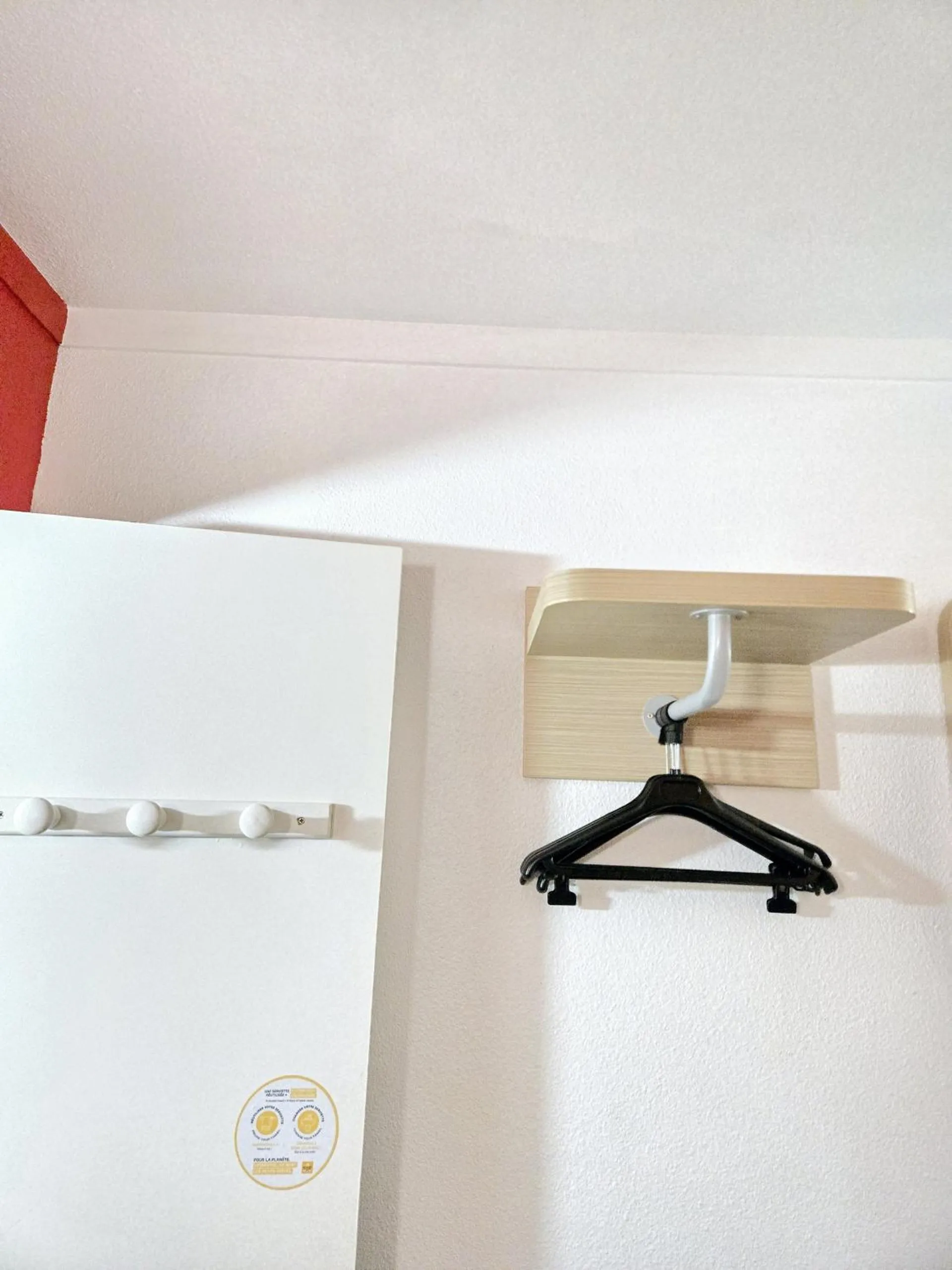 wardrobe in PREMIERE CLASSE ANGERS SUD Louvre Hotels group