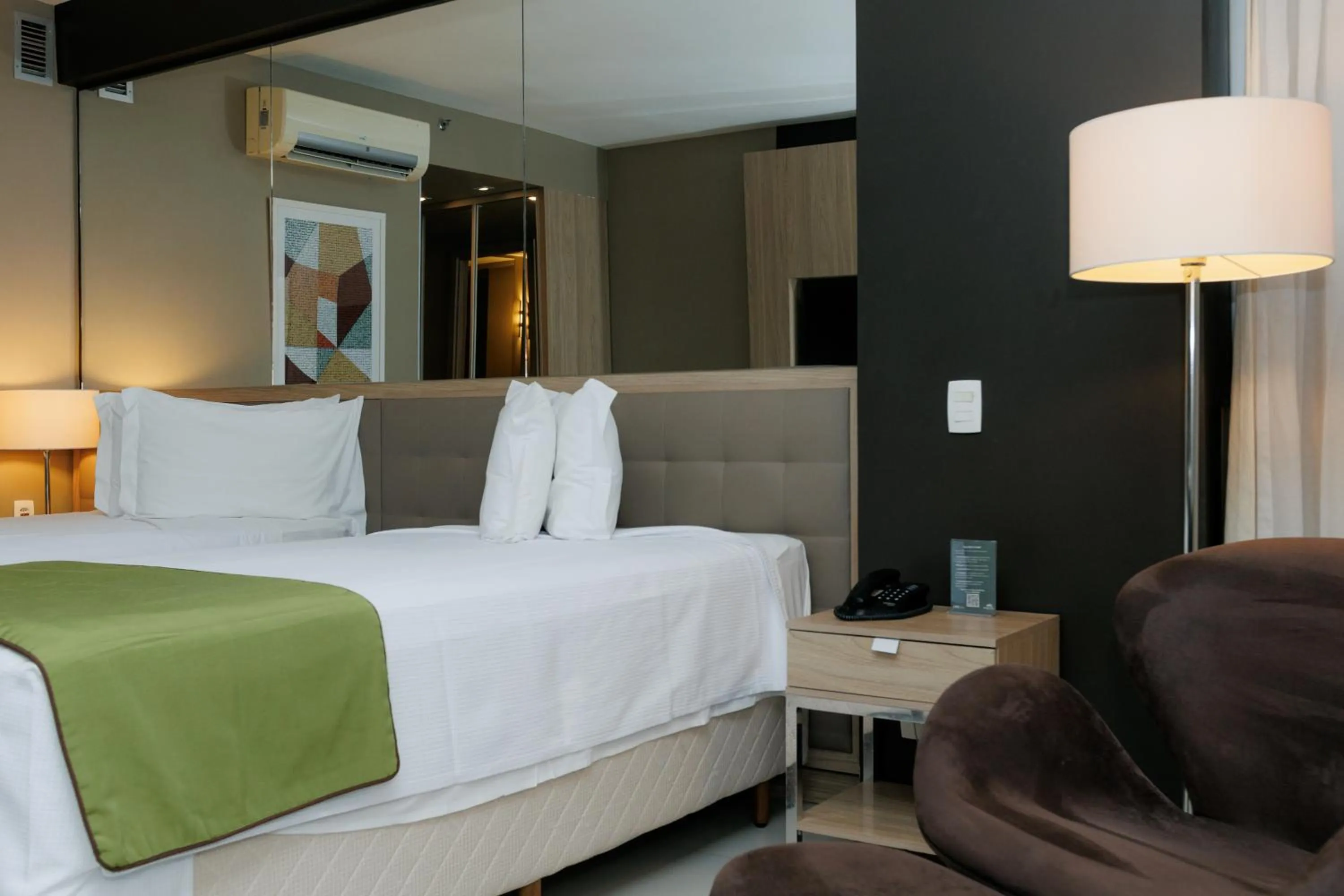 Bed in eSuites Savassi Toscanini