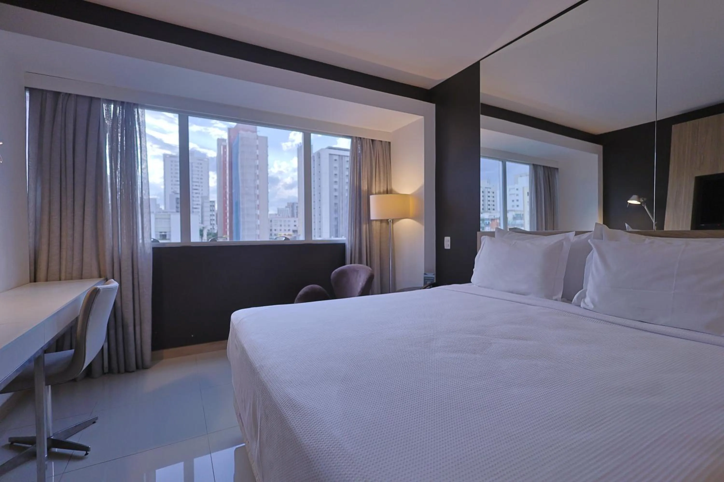 Bed in eSuites Savassi Toscanini