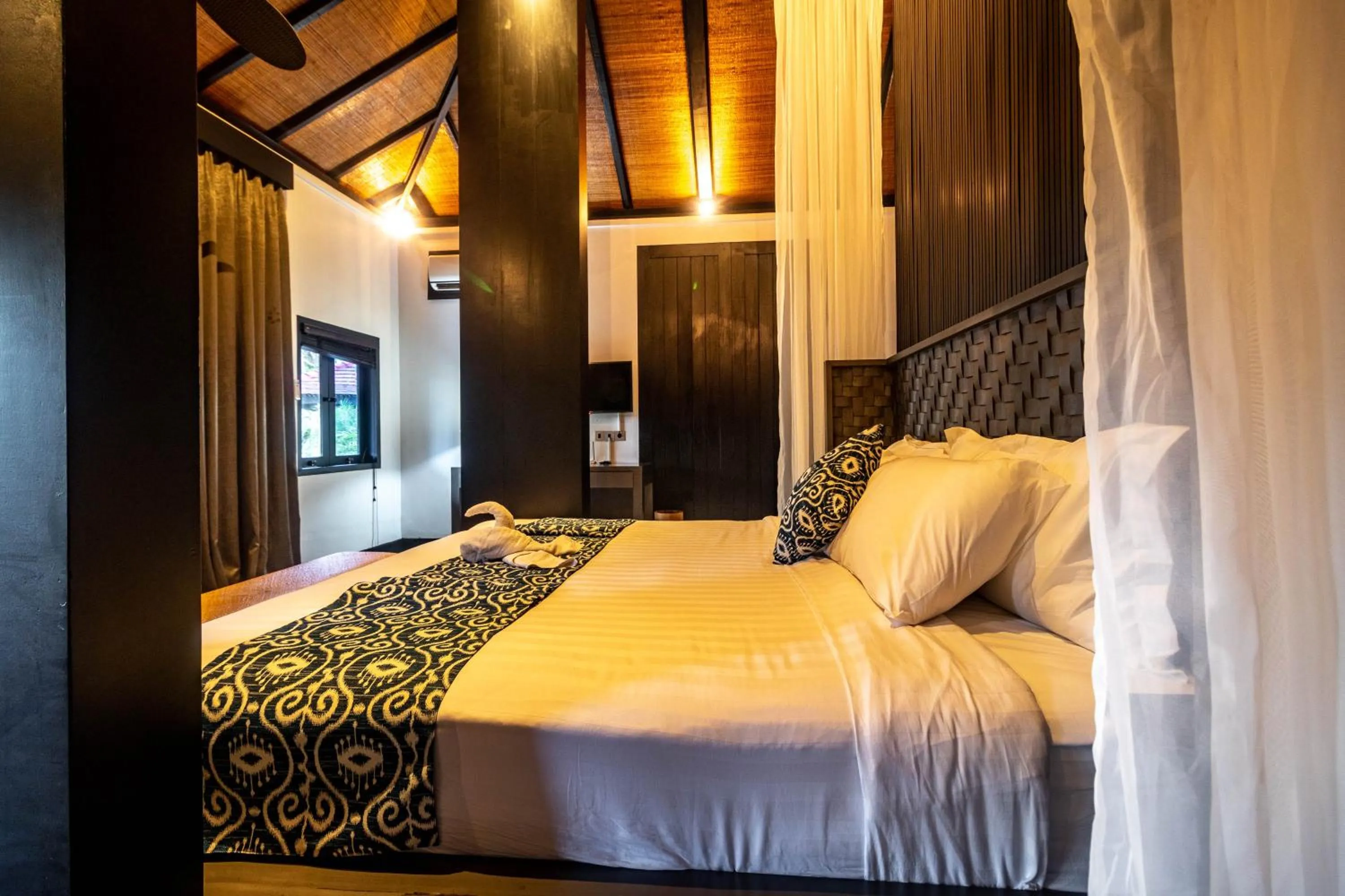 Bed in Surya Melasti Beach Villa