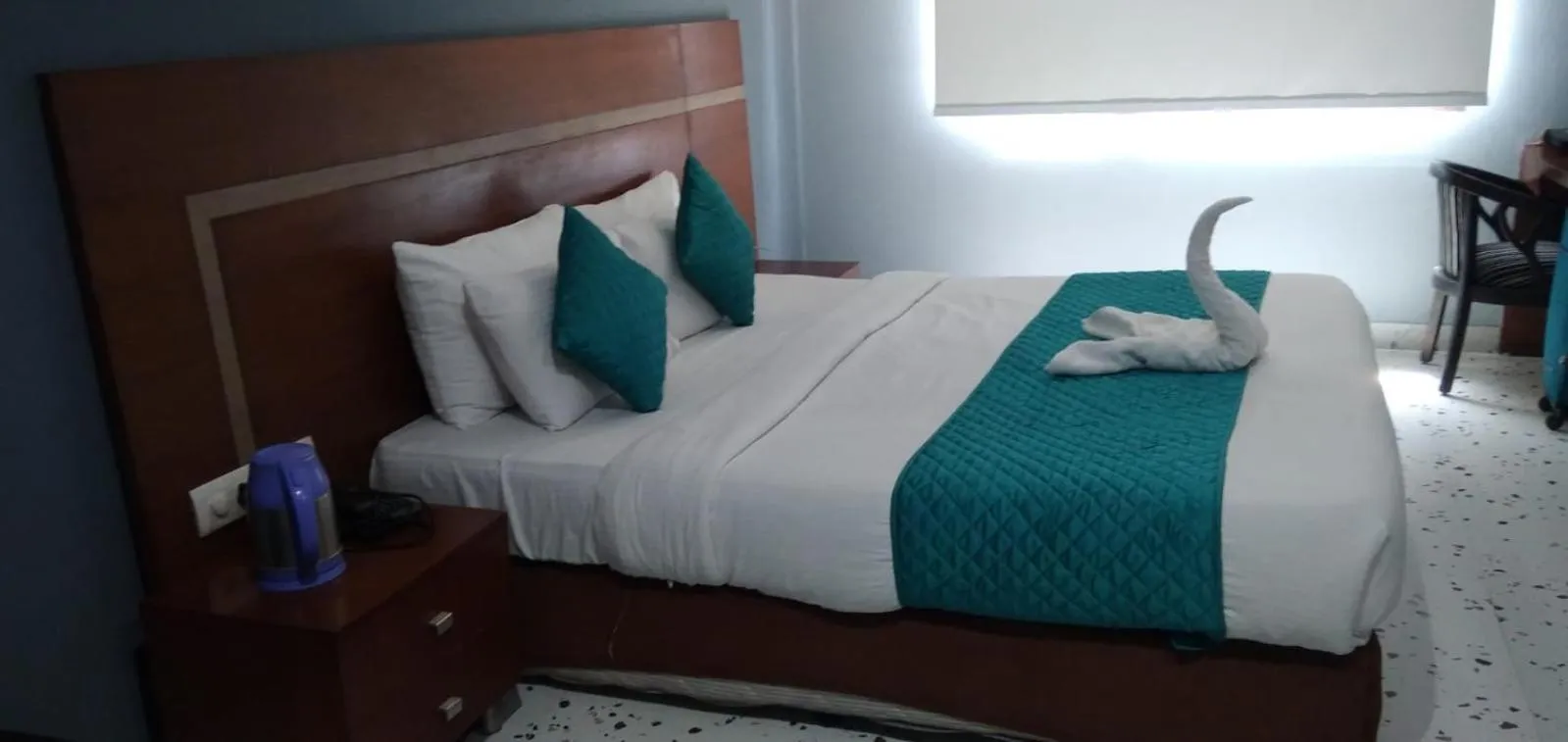 Bed in Asian Suites IFFCO Metro Station Gurugram