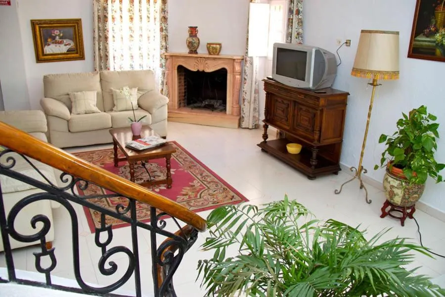 Communal lounge/ TV room in Hotel Mi Casa