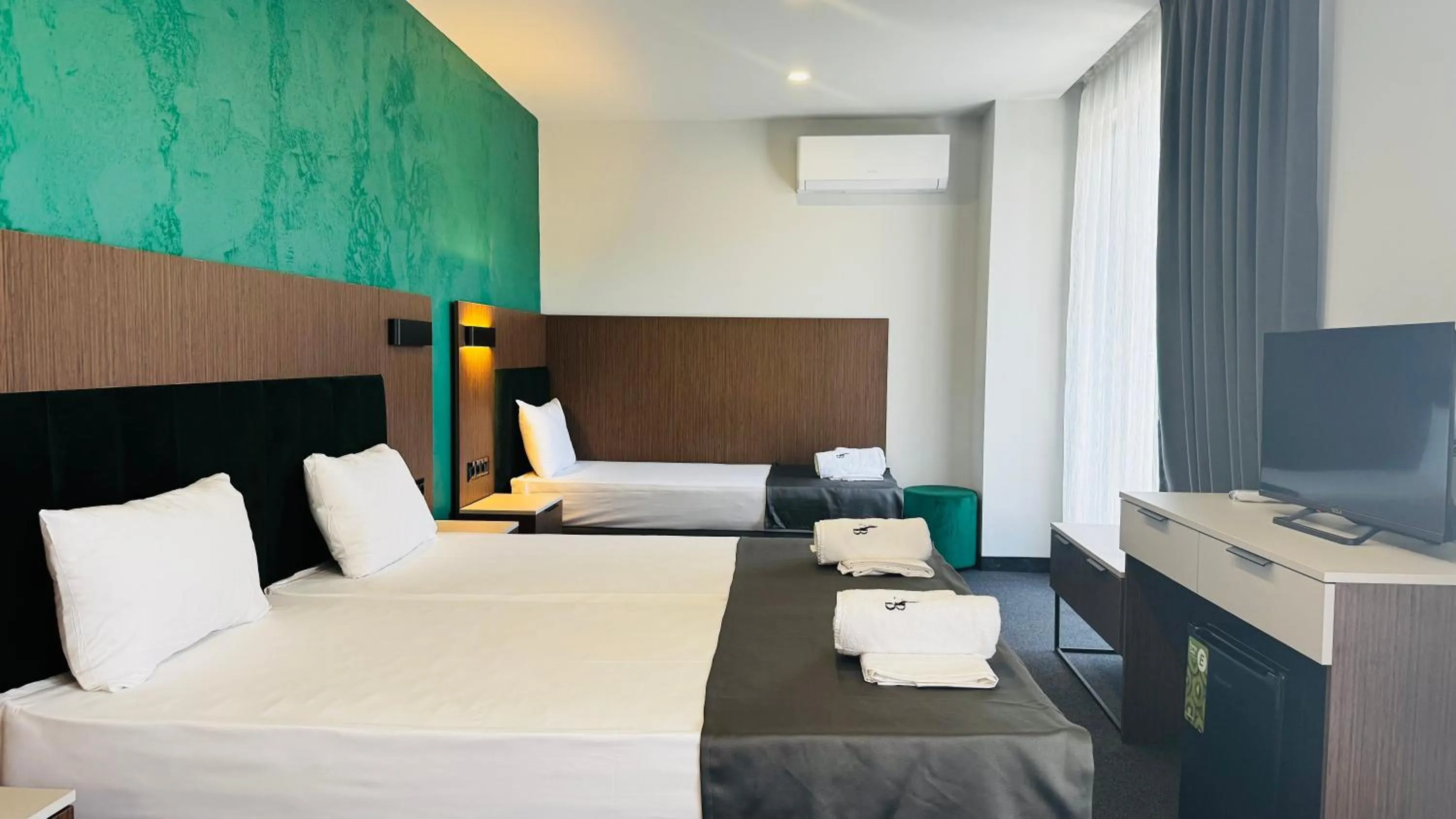 Bed in Atliman Beach Park Hotel