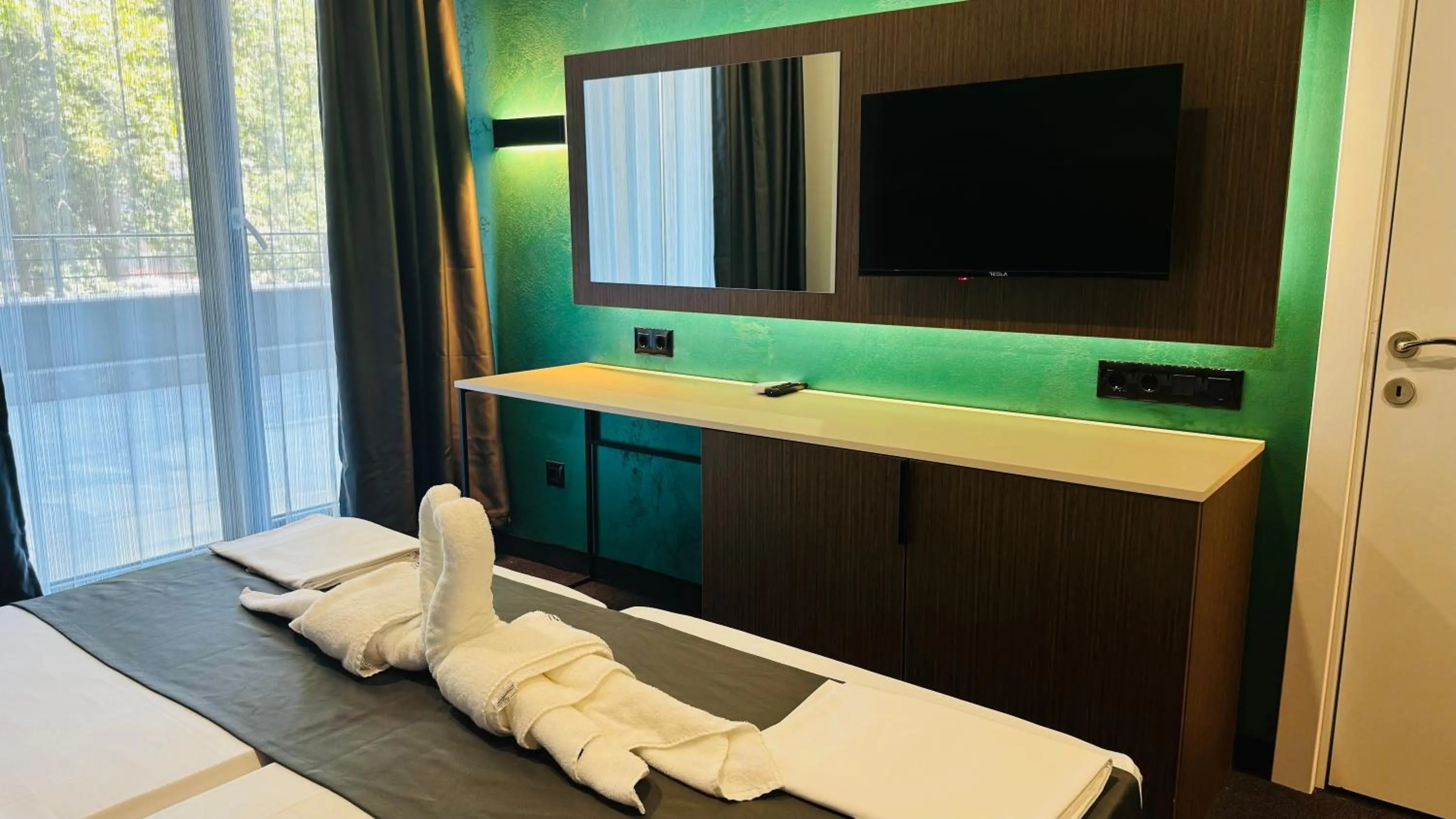 Bed in Atliman Beach Park Hotel