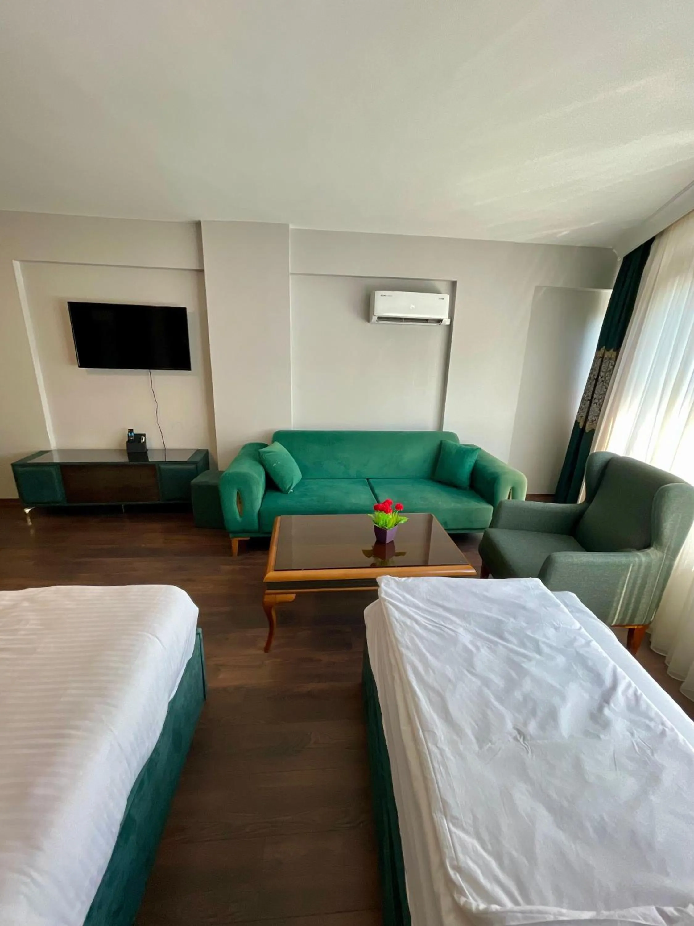 Bed in Aymira Suite Hotel