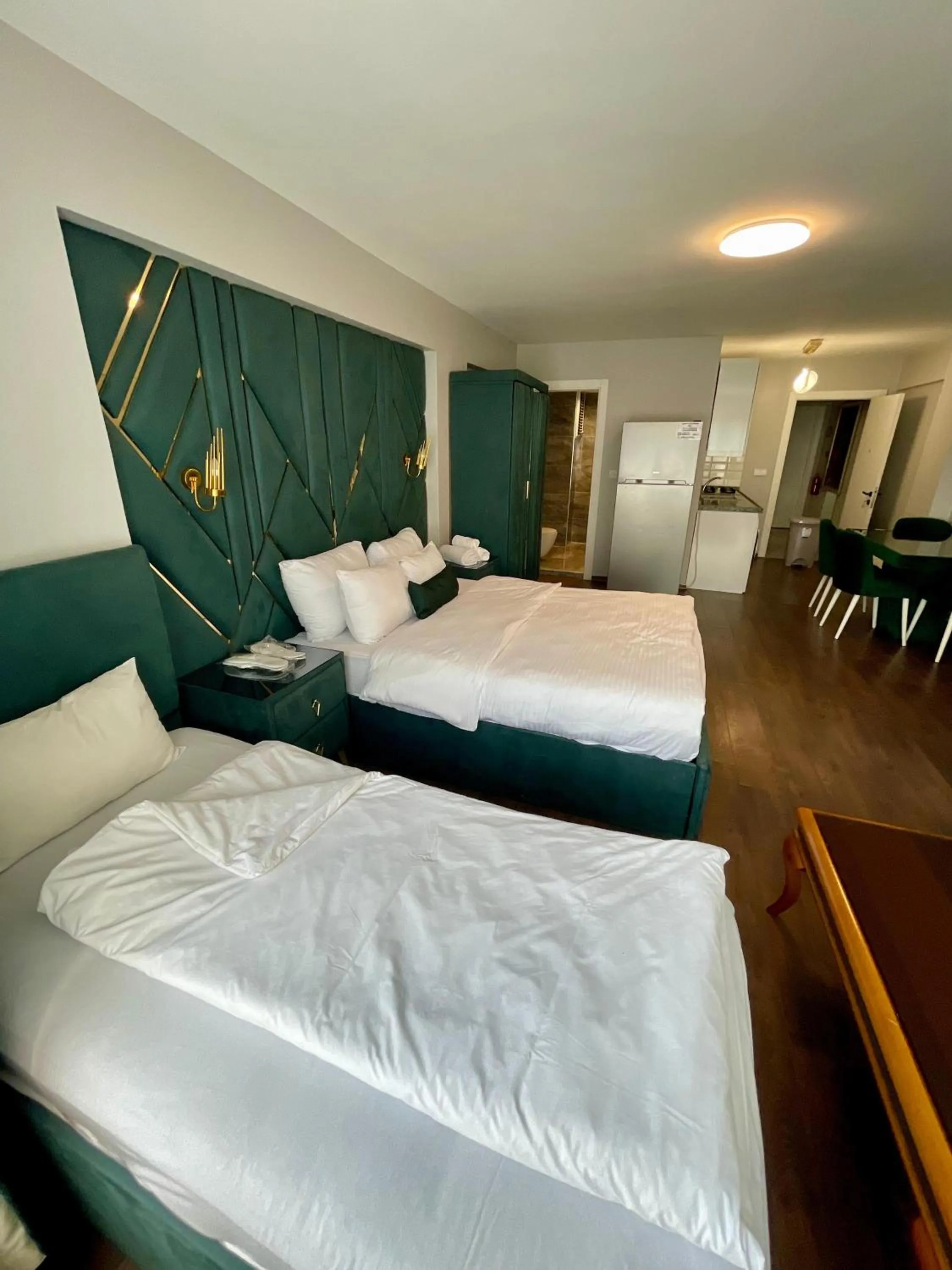 Bed in Aymira Suite Hotel