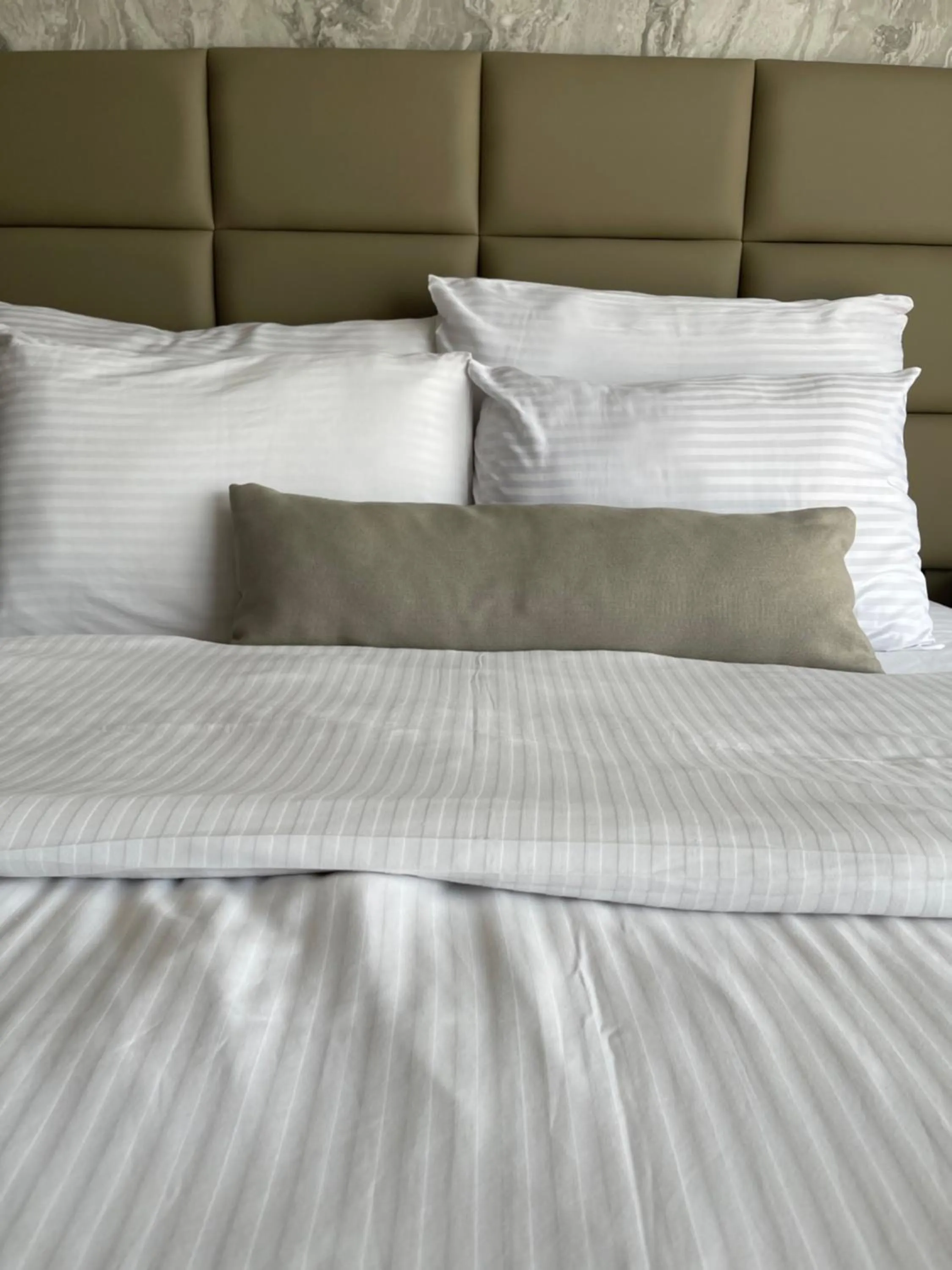 Bed in Aymira Suite Hotel