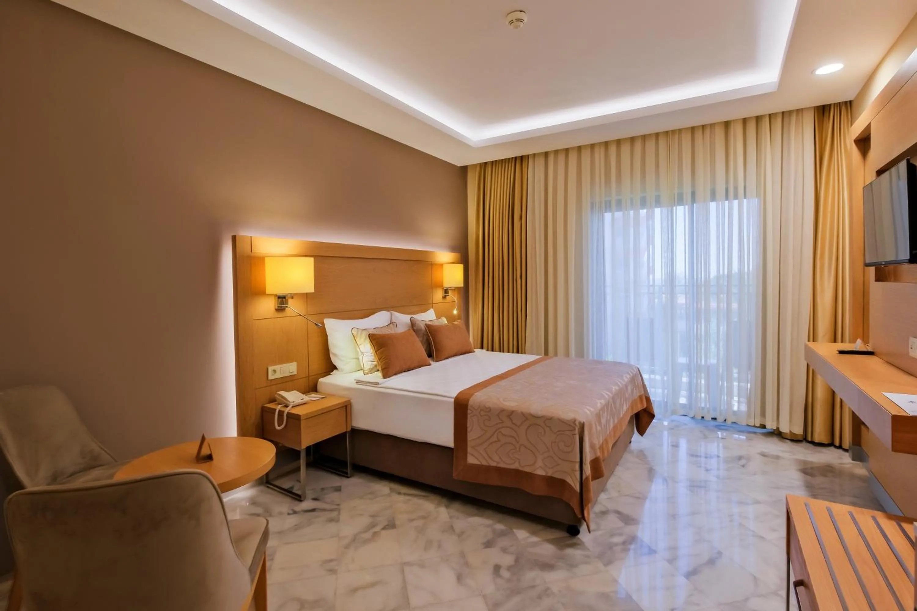 Bed in Belconti Resort Hotel