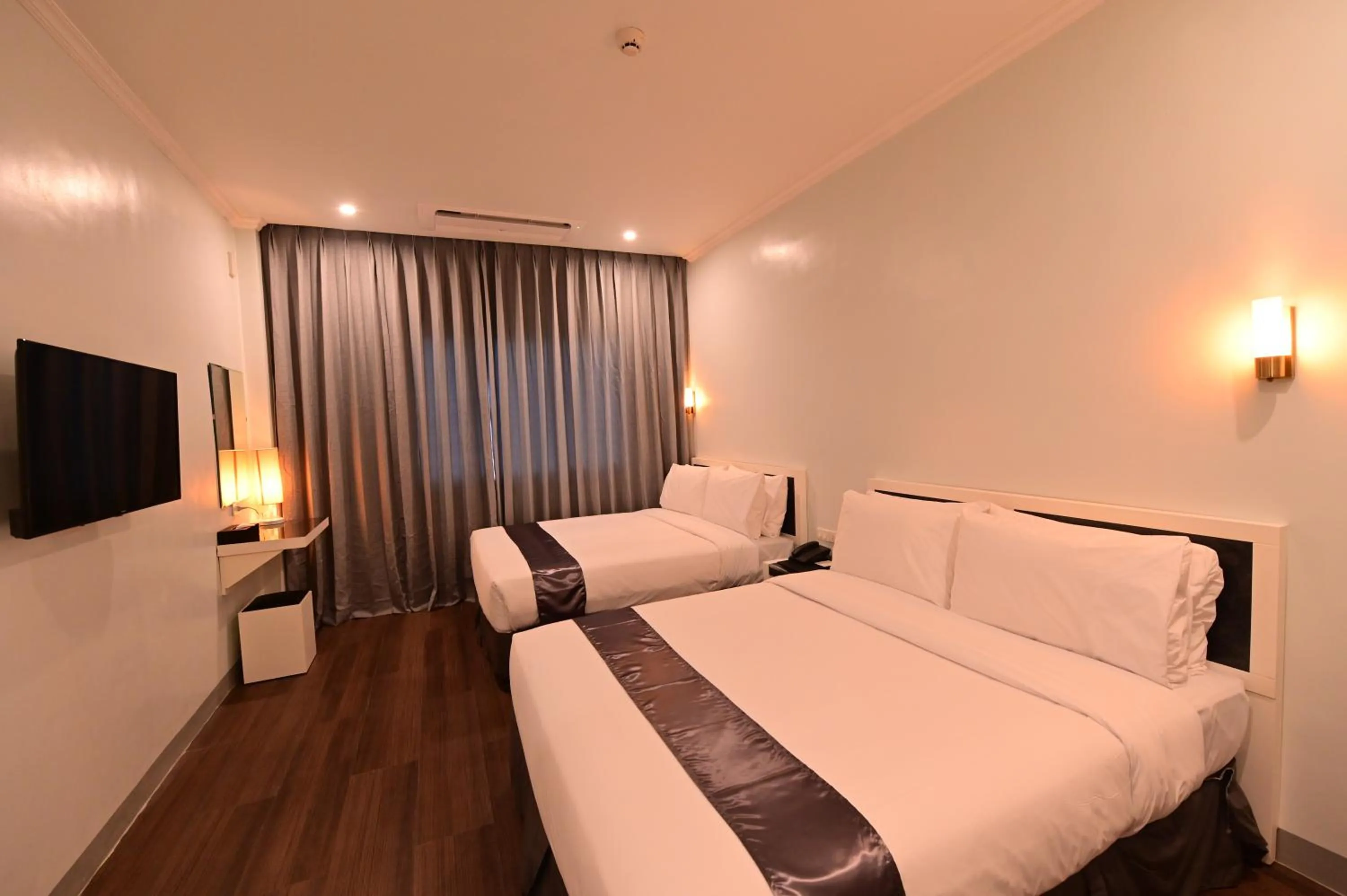 Bed in T Shine Resort and Spa