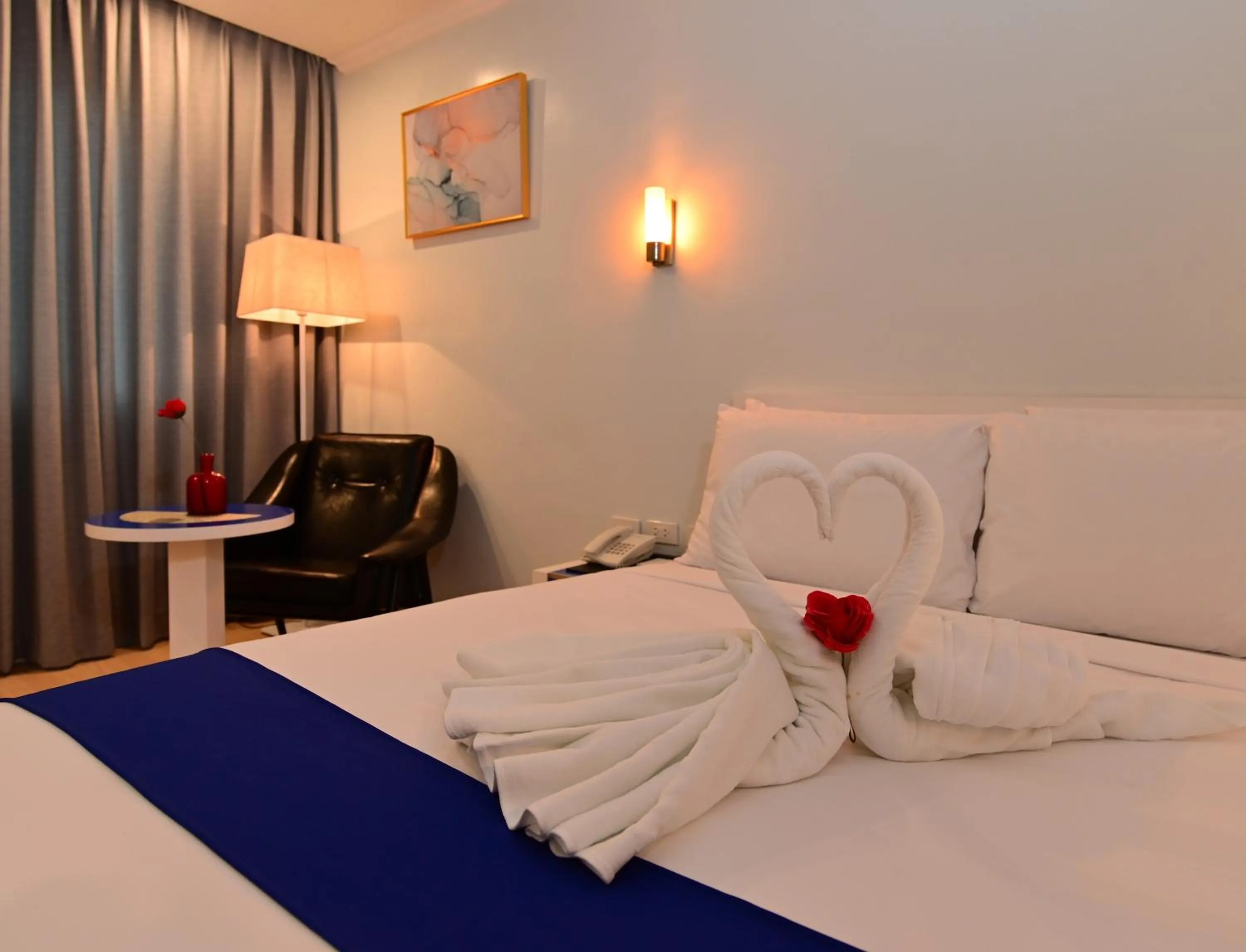 Bed in T Shine Resort and Spa