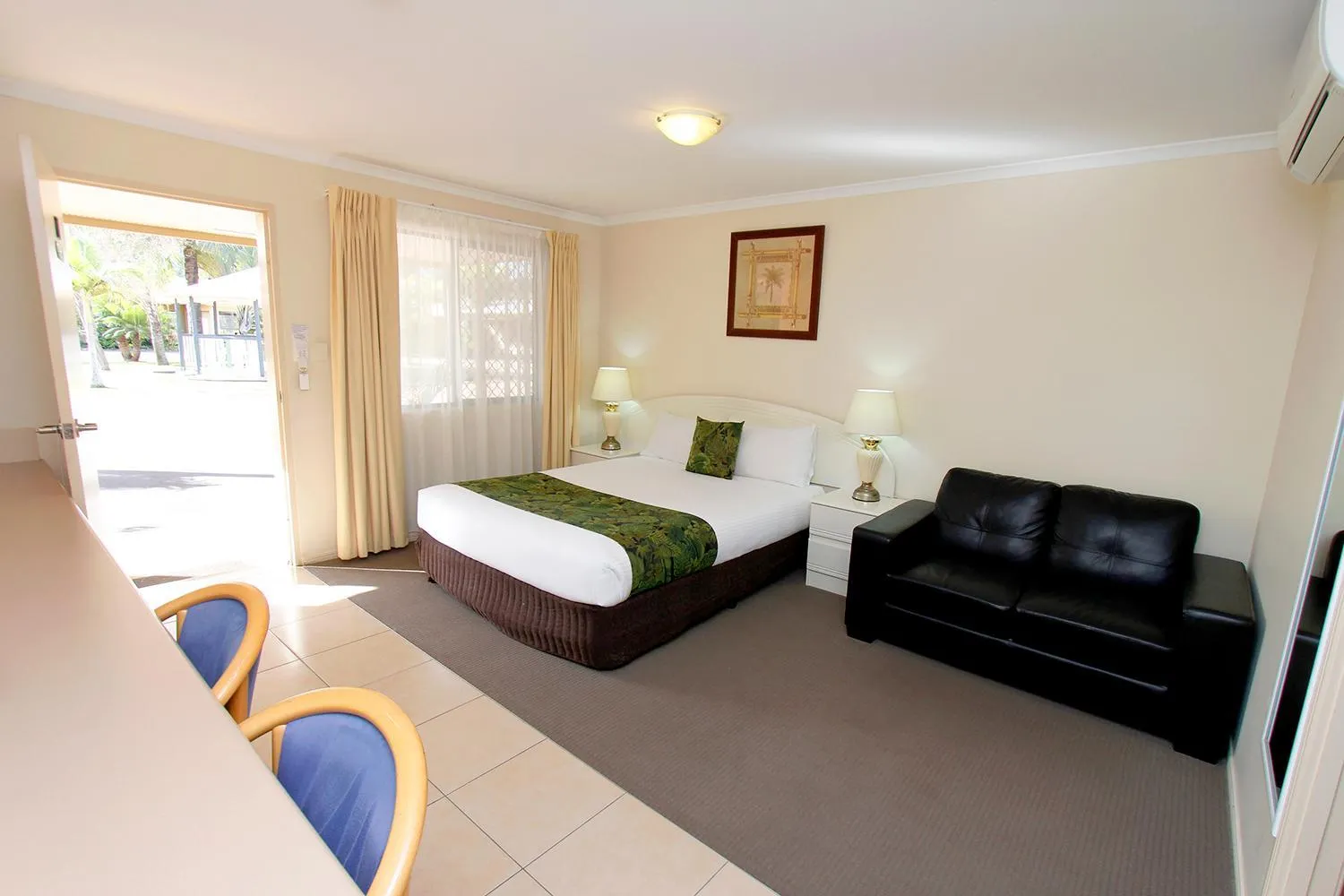 Bed in The Palms Motel