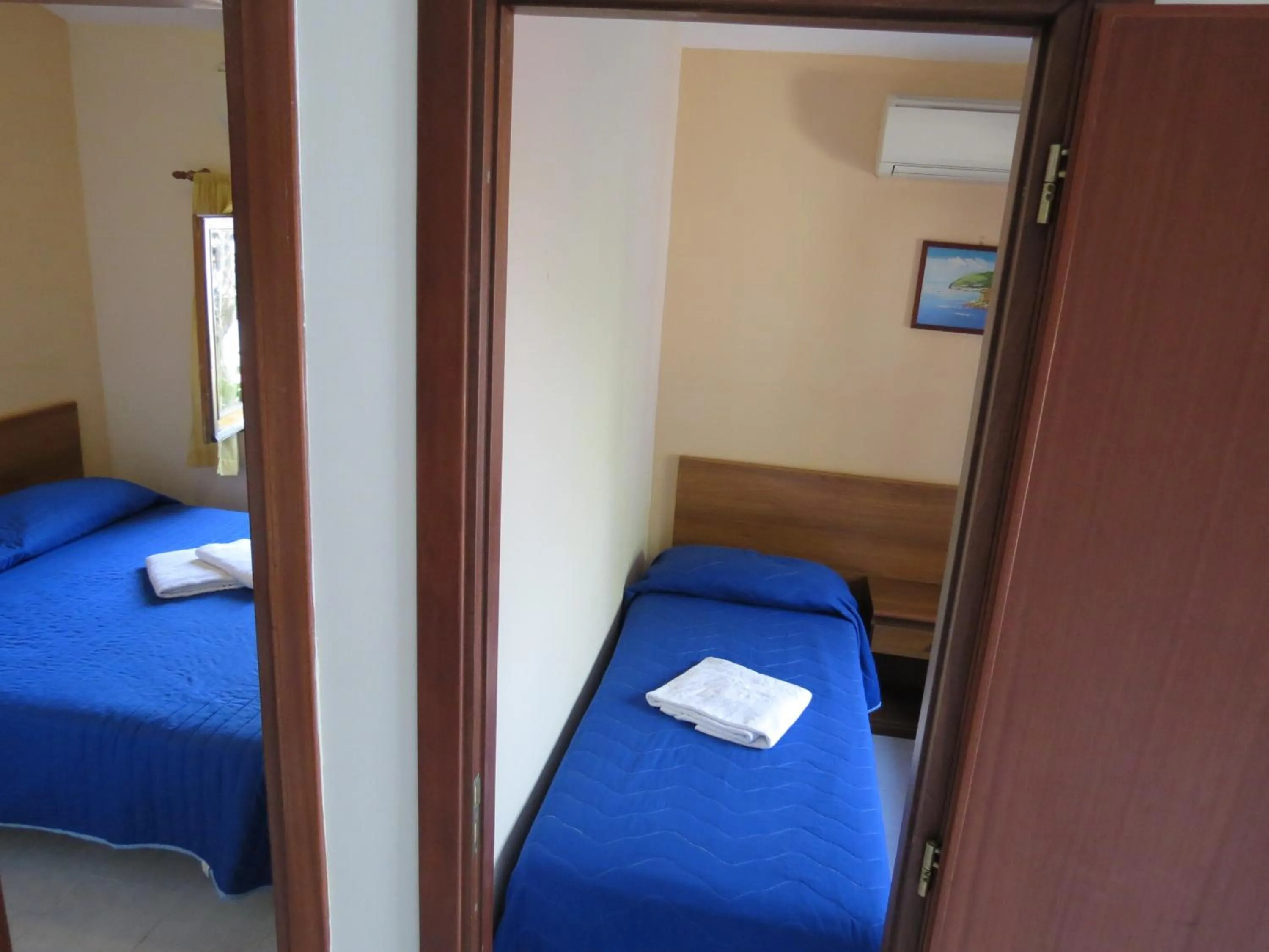 Photo of the whole room, Bed in Baia Serena