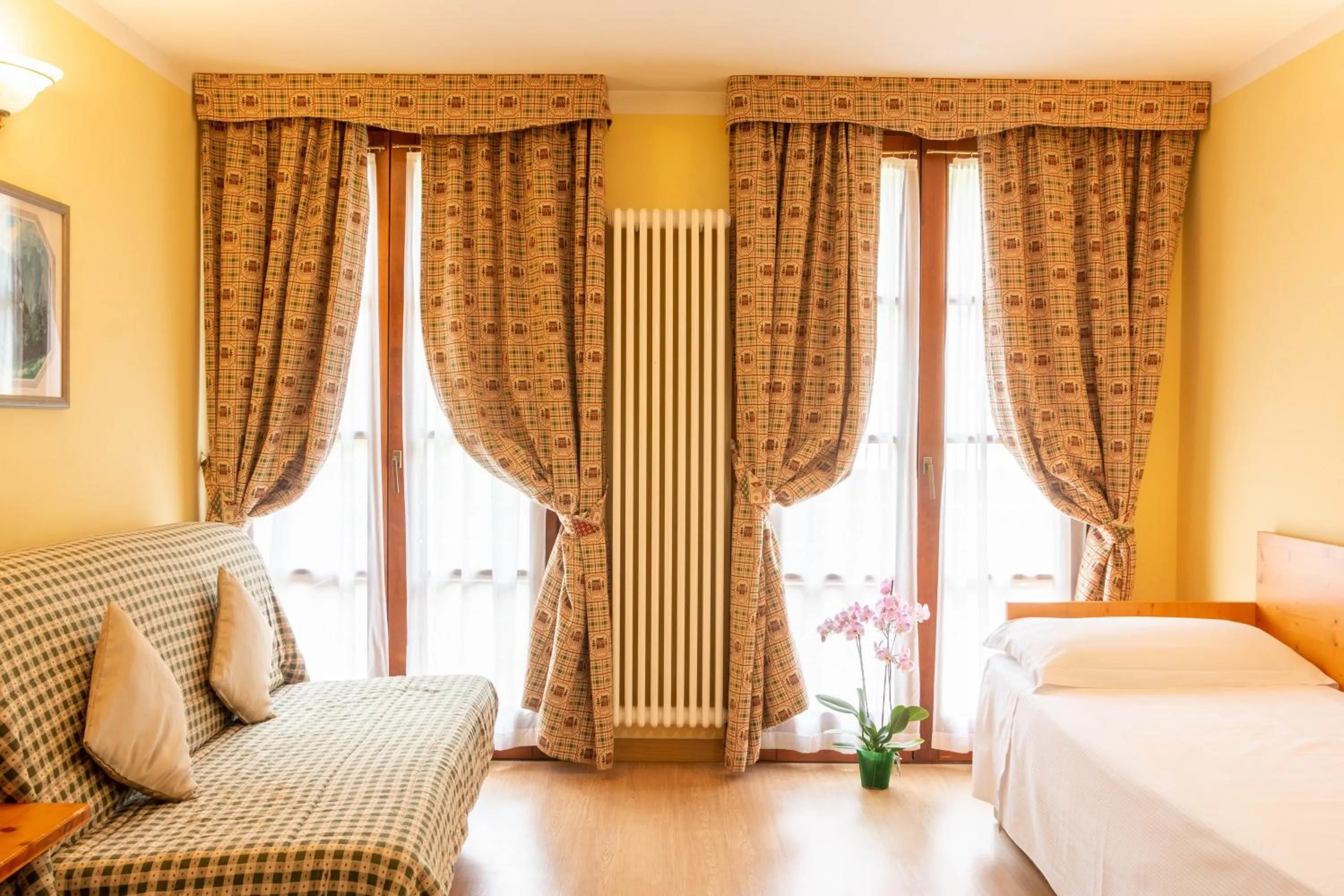 Living room, Bed in Nevesole Folgarida Resort Aparthotel