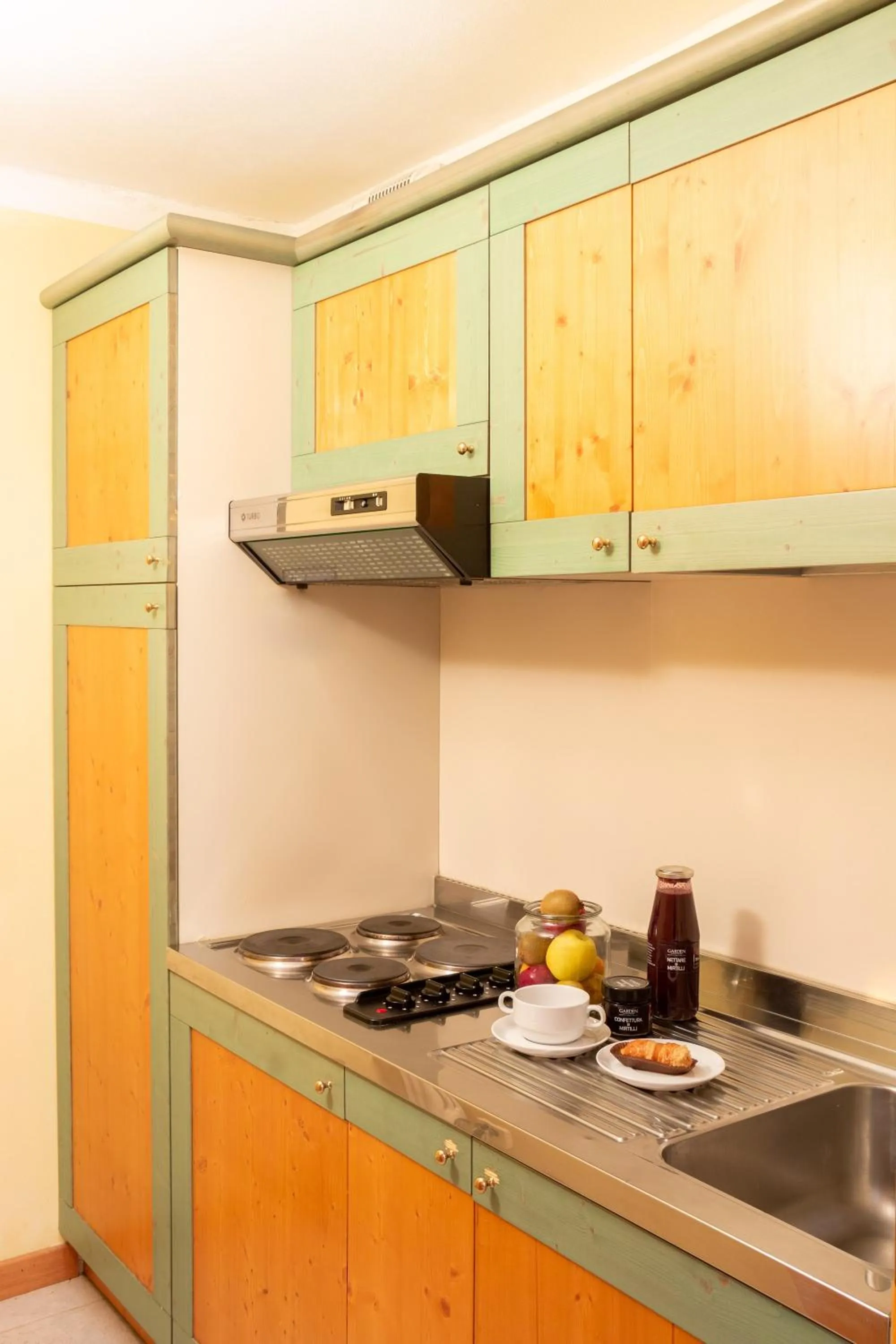 Kitchen or kitchenette in Nevesole Folgarida Resort Aparthotel