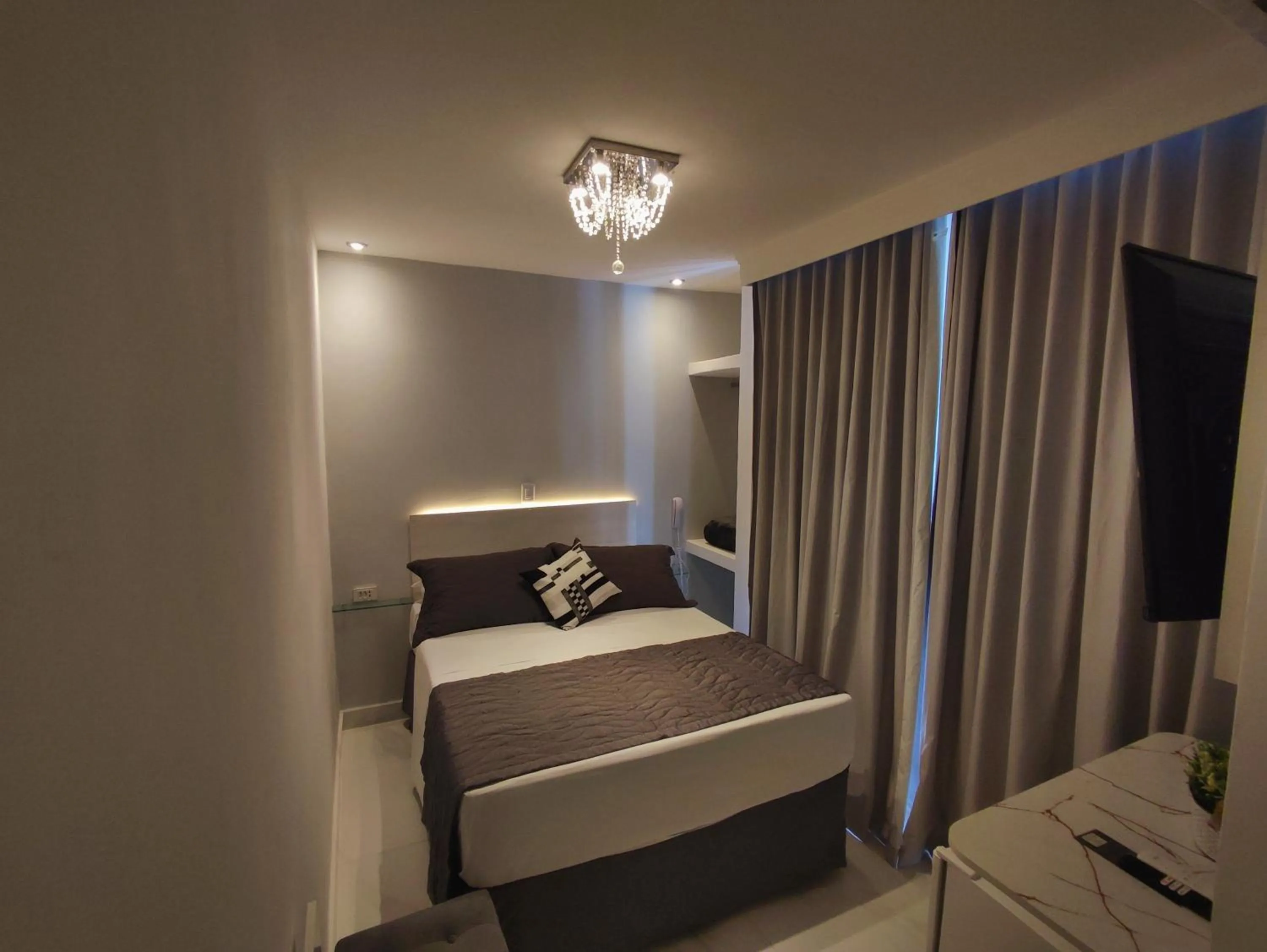 Photo of the whole room, Bed in Grand Hotel Guarujá - A sua Melhor Experiência Beira Mar na Praia!