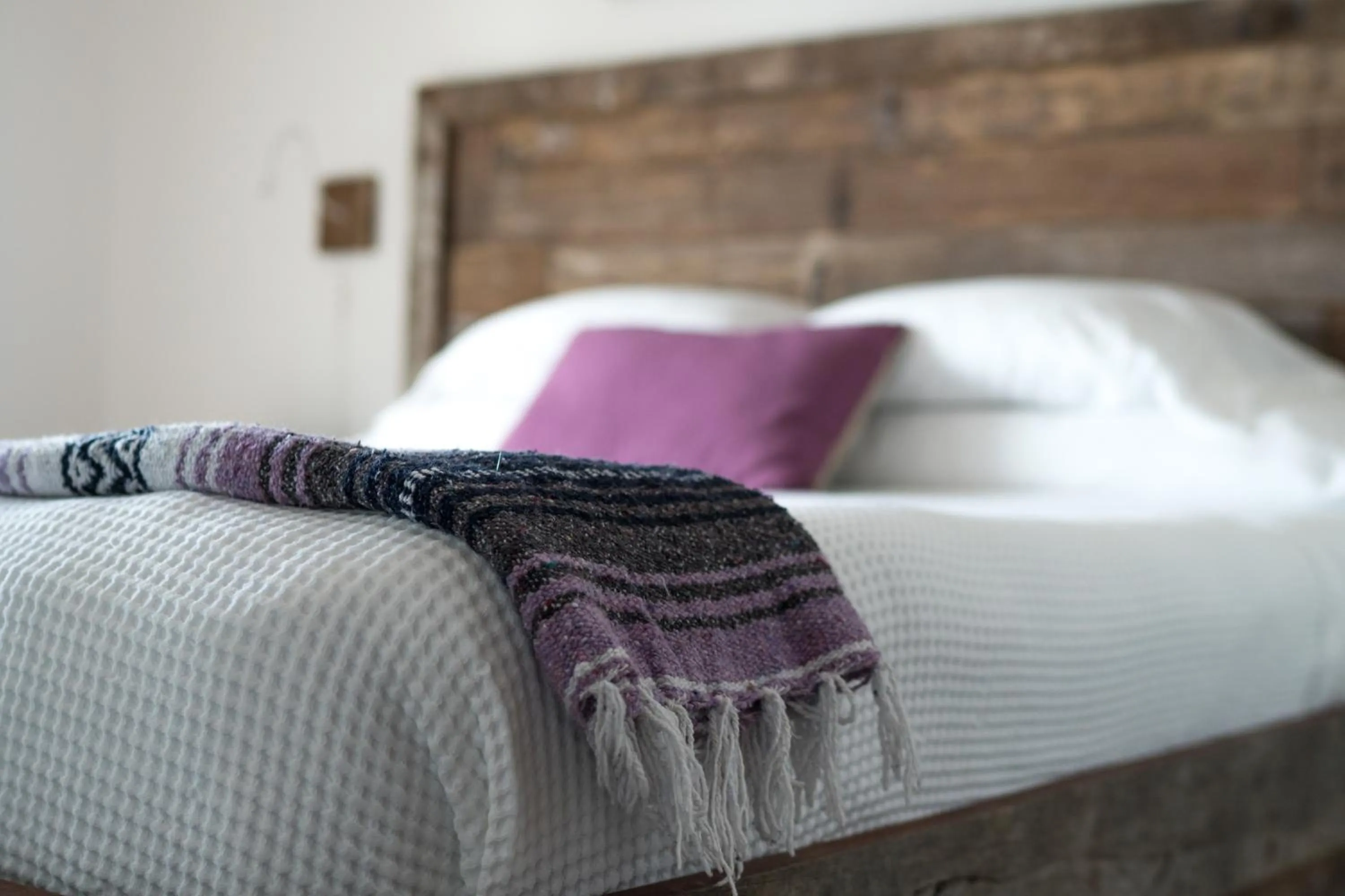 Bed in Thatch Caye Resort a Muy'Ono Resort