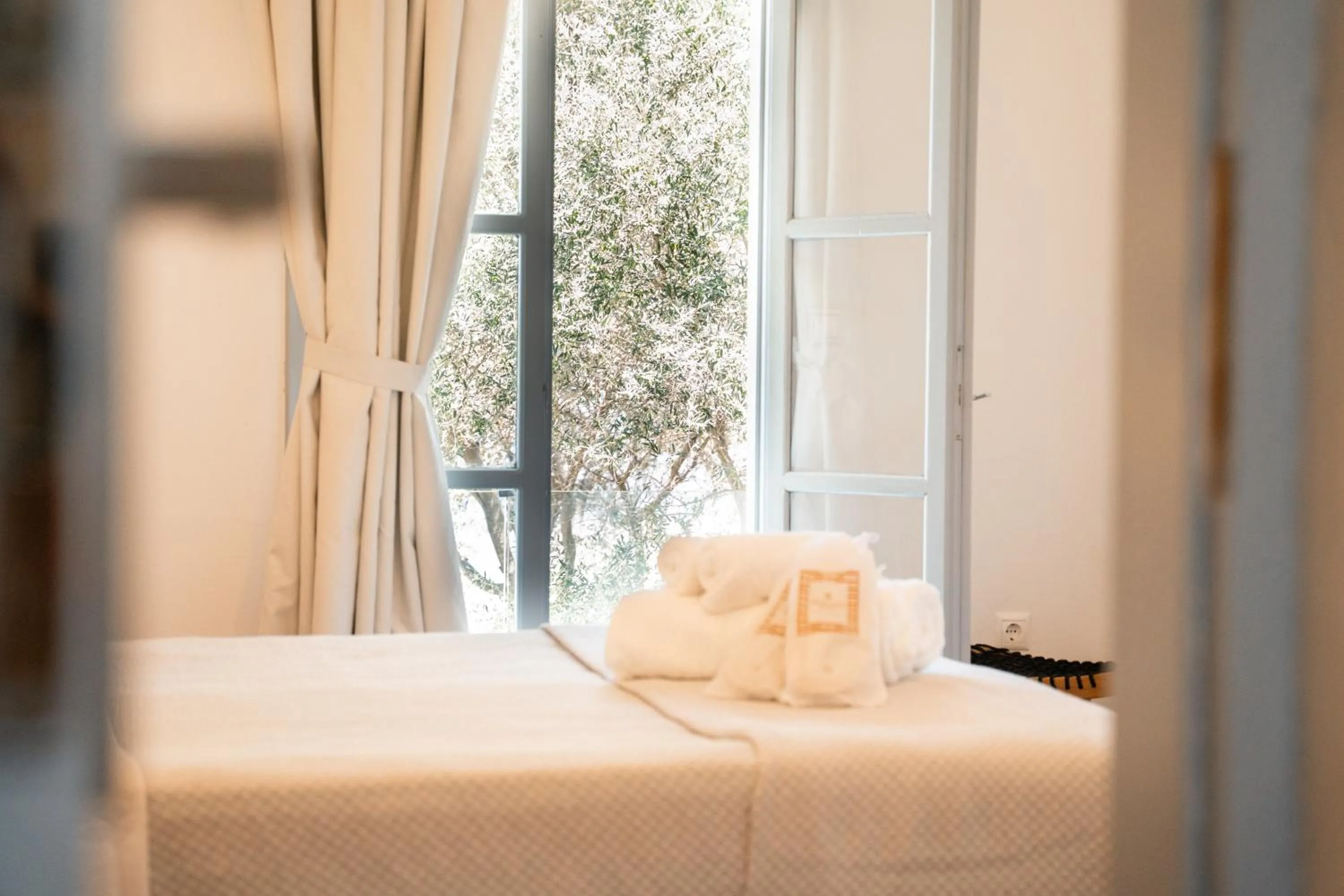 Bed in Divino Suites